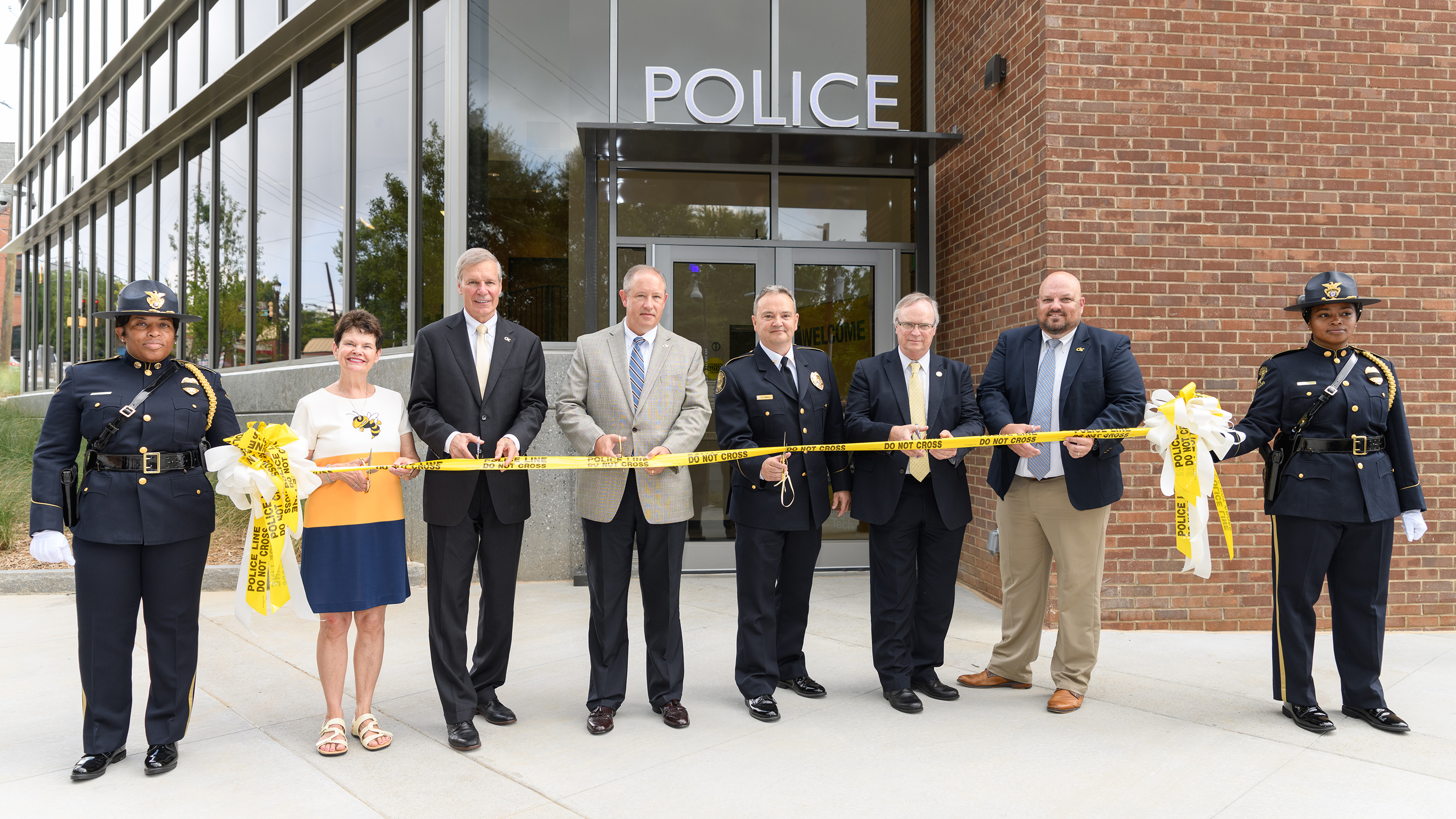Georgia Tech Police Department Honor Guard accompanies Georgia Tech officials cut the ribbon on the new GTPD Police Department building. From left, Honor Guard Officer Cassandra Davis, First Lady Val Peterson, President G.P. "Bud" Peterson, Interim Executive Vice President of Administration and Finance Jim Fortner, GTPD Chief Robert Connolly, University System of Georgia Chief of Police Bruce Holmes, Director of Emergency Preparedness William Smith and Honor Guard Officer Jessica Howard. 