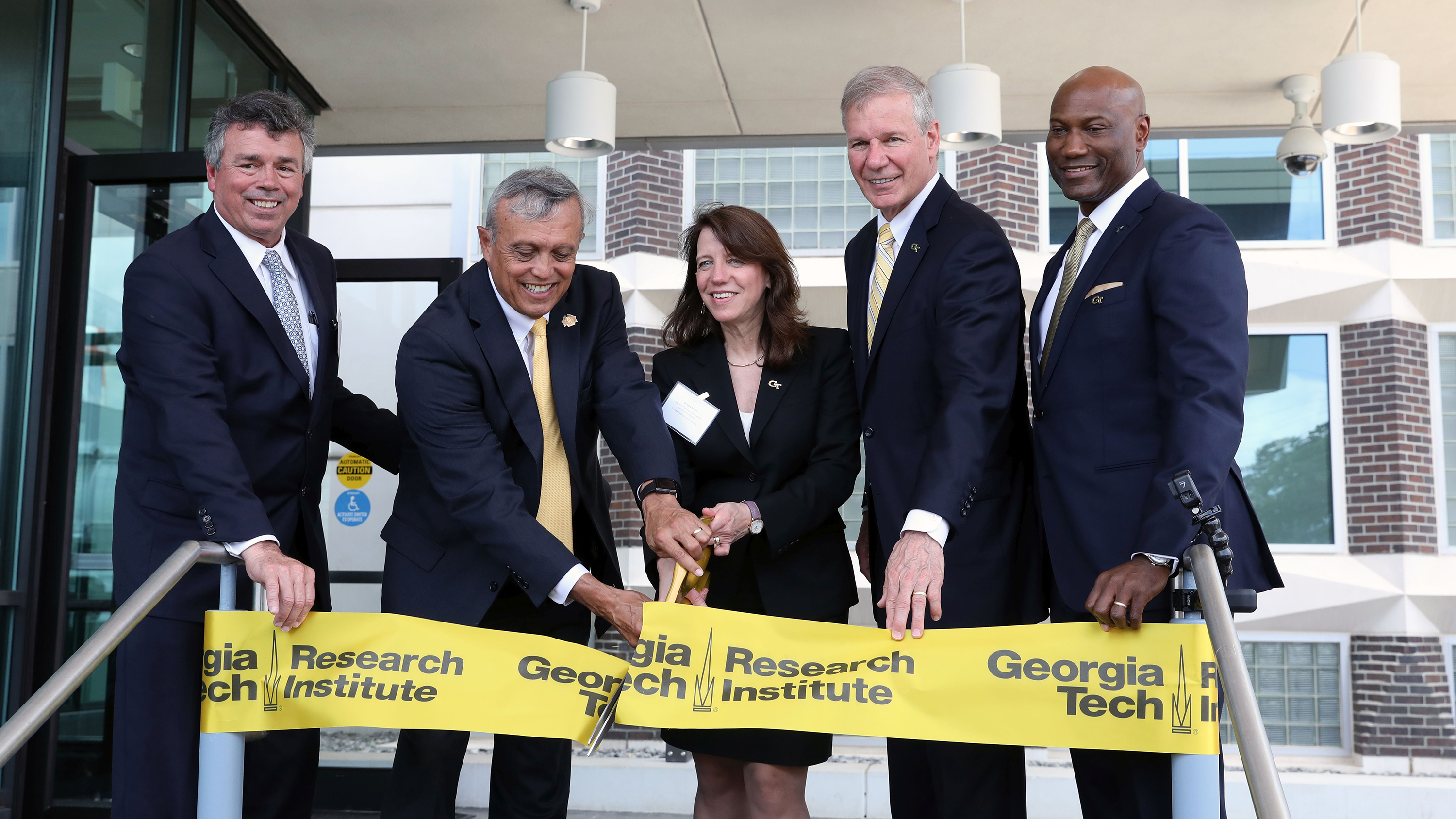 Cutting the ribbon on the new GTRI Cobb County Research Facility South Campus were, from left, Georgia Tech executive director of Real Estate Development Tony Zivalich, Chairman of the Cobb County Board of Commissioners Mike Boyce, Interim Director of GTRI Lora Weiss, Georgia Tech President G.P. “Bud” Peterson, and Lockheed Martin's new Vice President and General Manager Rod McLean. Photo: Sean McNeil
