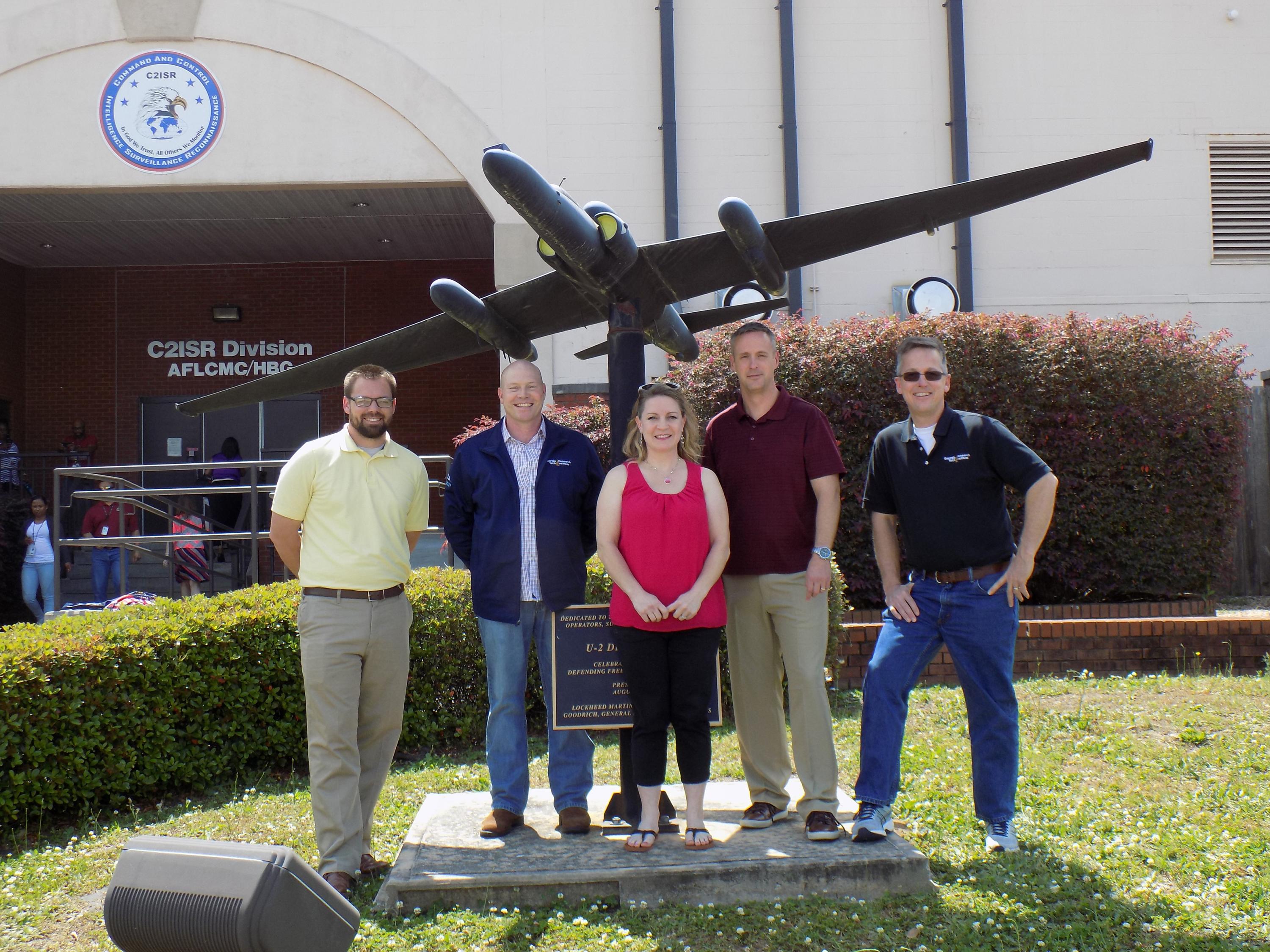 Photo shows a portion of the Warner Robins-based GTRI team that is supporting the Air Force Distributed Common Ground System. Shown (left-to-right) are Derek Munday, Shawn Ashley, Amy Donovan, Clayton Besse and Mark Burnette. (Photo Credit: Georgia Tech Research Institute)