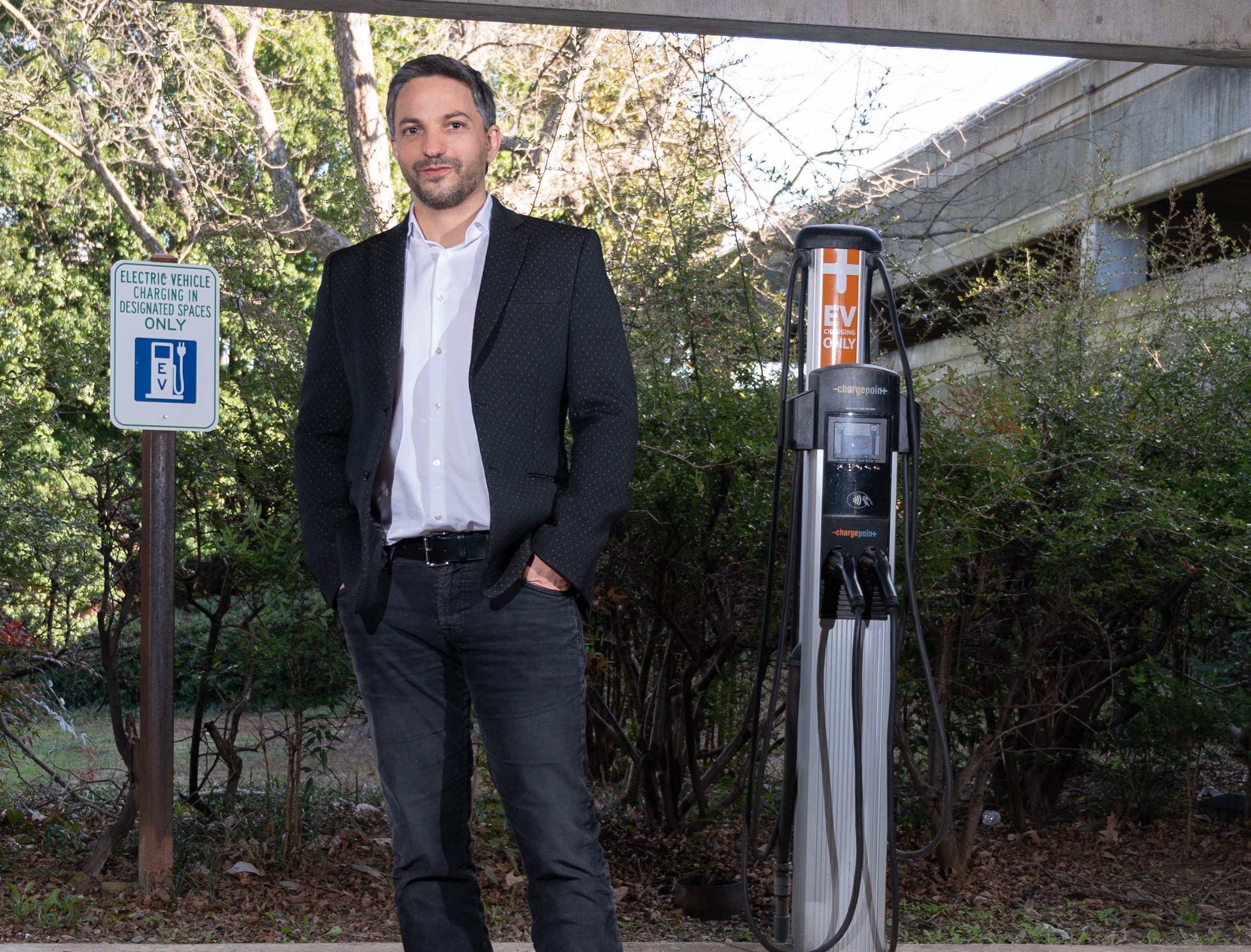 Georgia Tech professor Gleb Yushin, at a campus EV charging station, sees melt-infiltration technology opening the floodgates to more Lio-ion battery innovation. (Photo credit: Allison Carter, Georgia Tech)