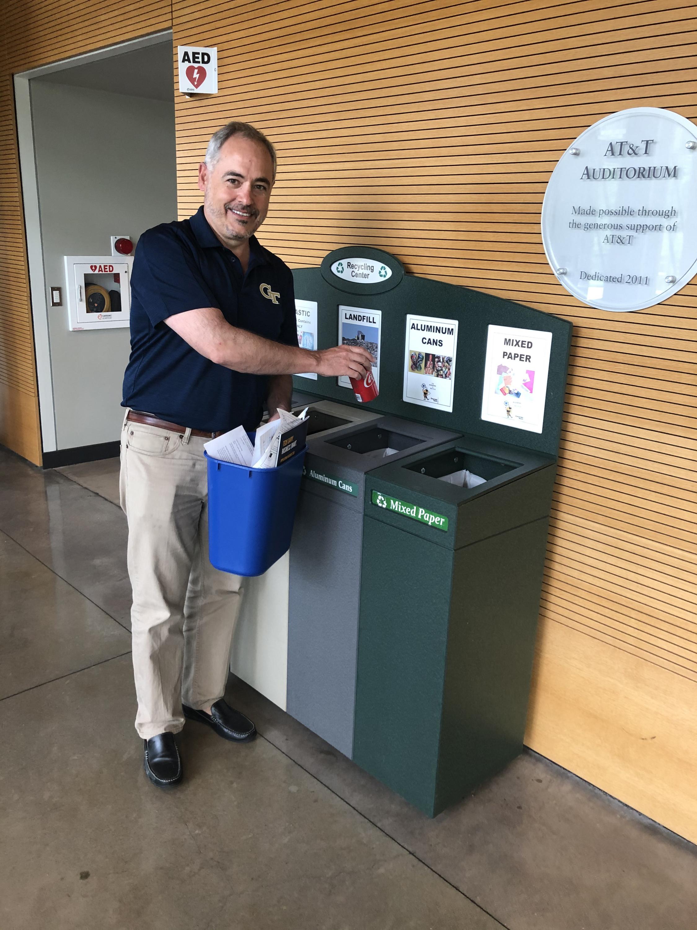 President Cabrera Sorts Recycling in Clough Commons [Note: This photo was taken prior to the Covid-19 pandemic.]