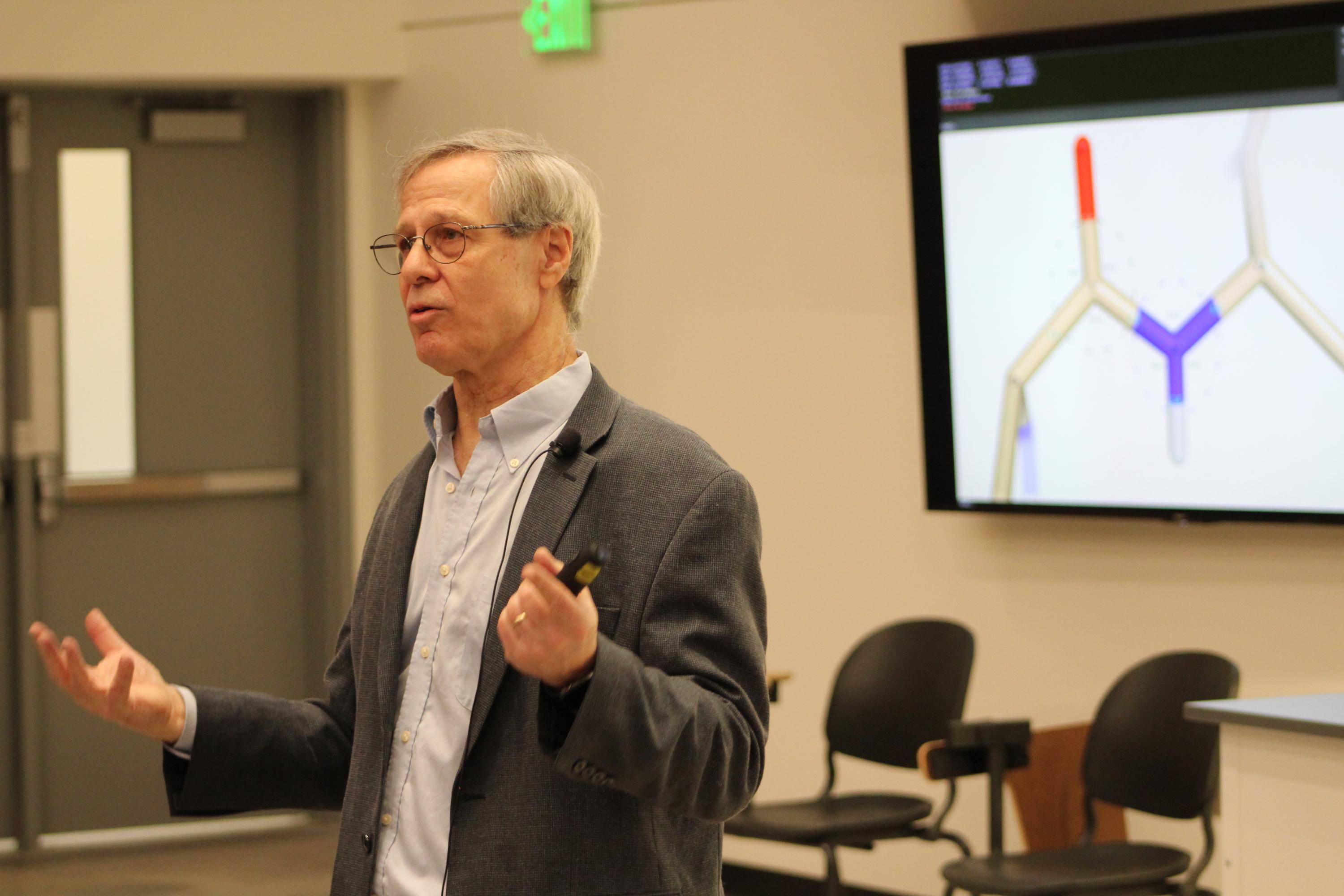 Professor Loren Wiliams holds a lecture in Howey Physics. 