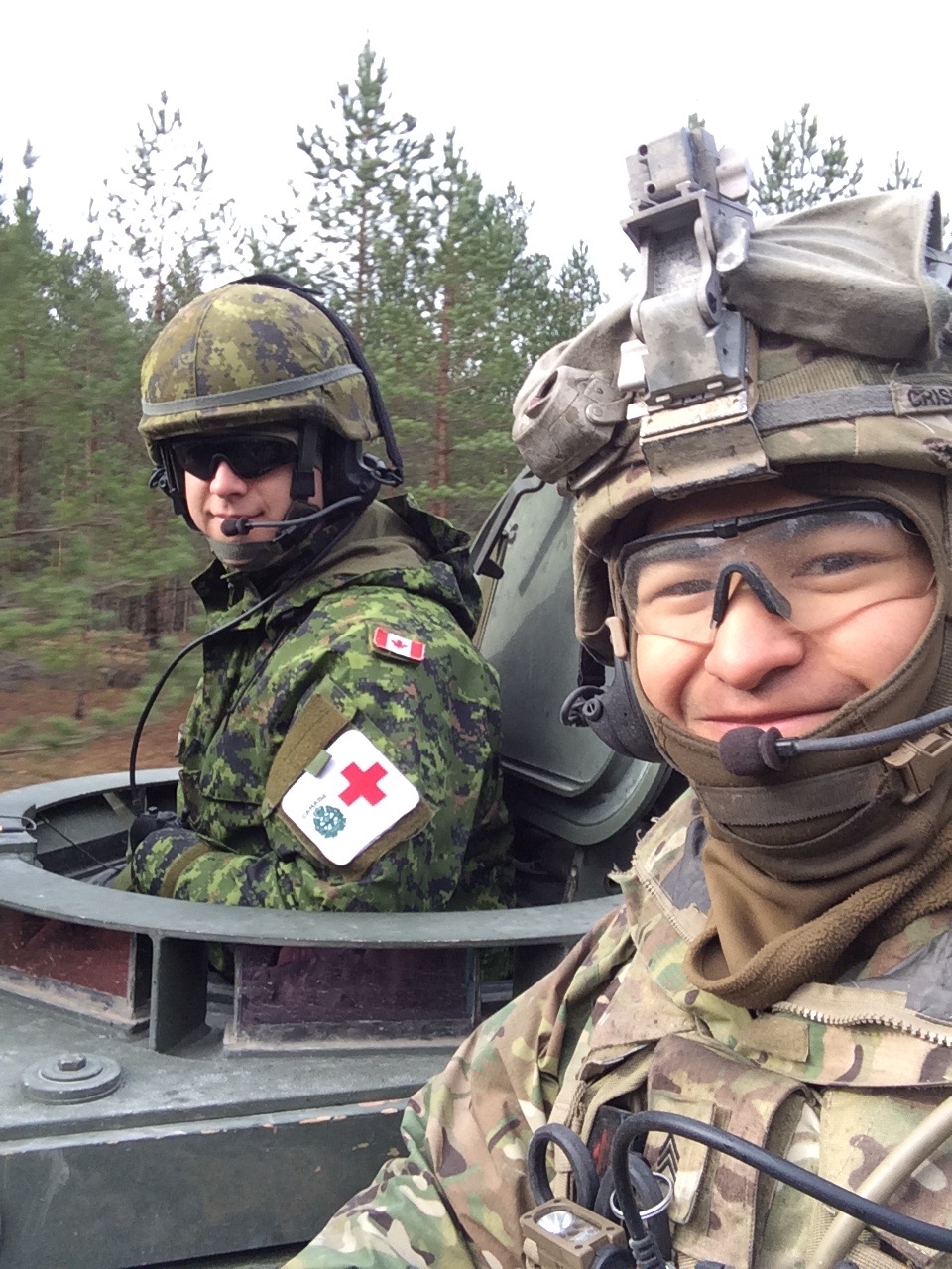 Corey Crisostomo (right) poses for a photo with a friend (left) during his service in the United States Army.
