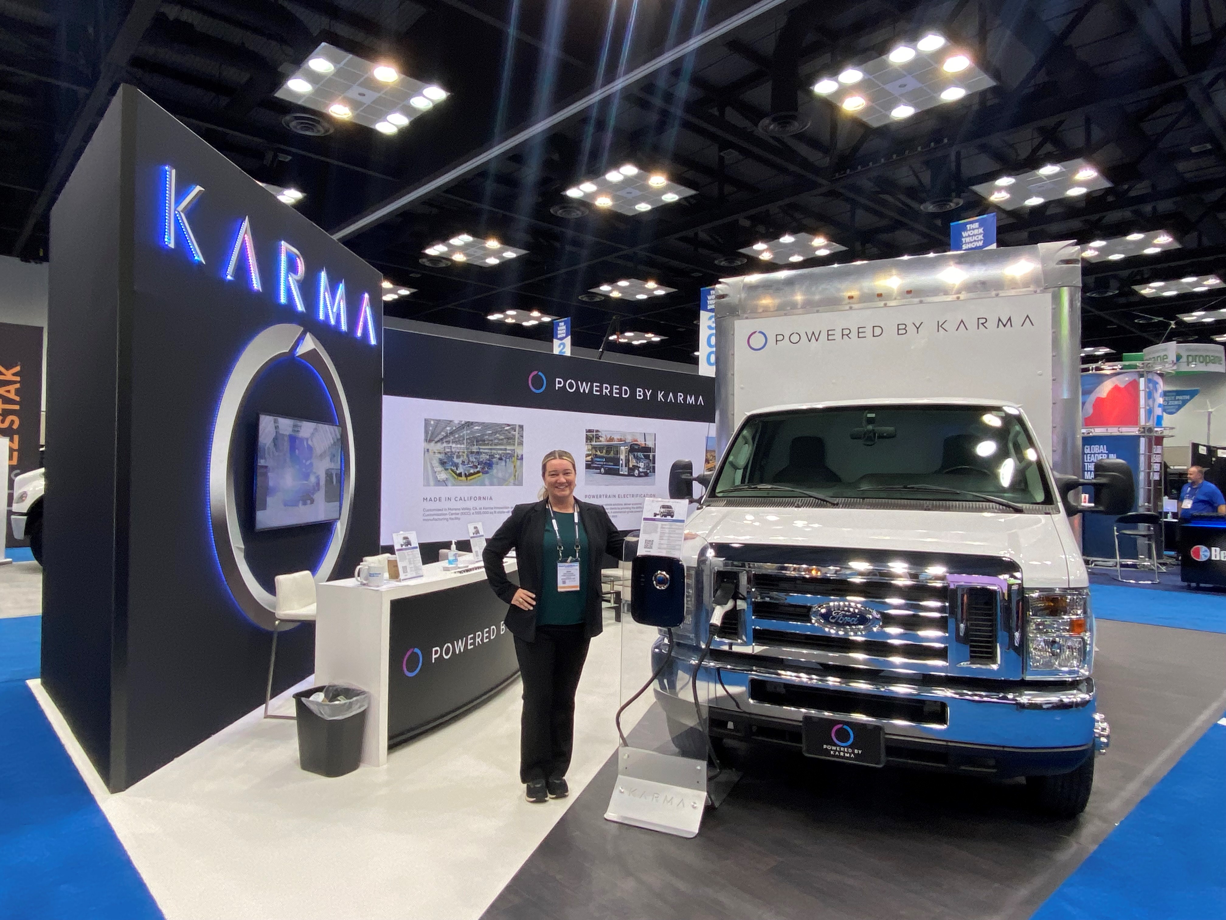 Jenn Voelker showcasing Karma's commercial product line at an auto show.&nbsp;