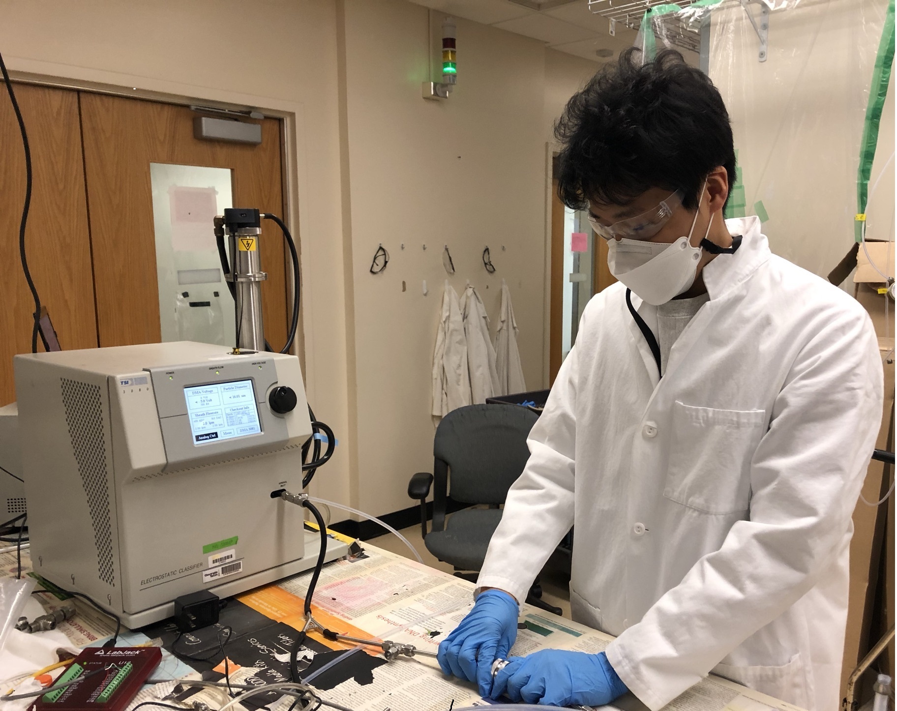 Graduate student Taekyu Joo setting up the filtration efficiency measurement system. (Credit: Fobang Liu, Georgia Tech)