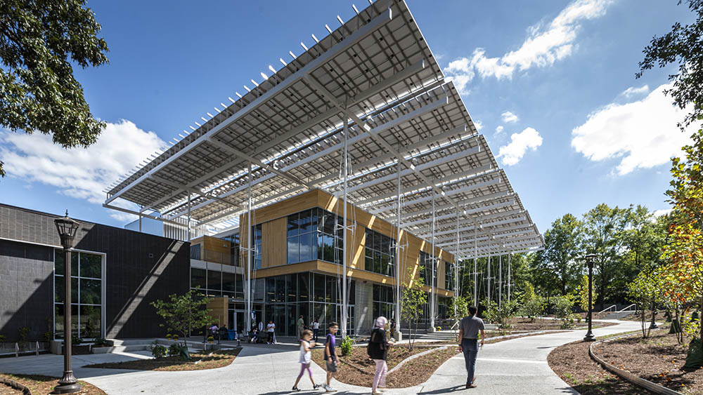 The Kendeda Building for Innovative Sustainable Design features a large "front porch" shaded by some of the hundreds of solar panels that generate electricity for the building. (Photo: Justin Chan Photography)