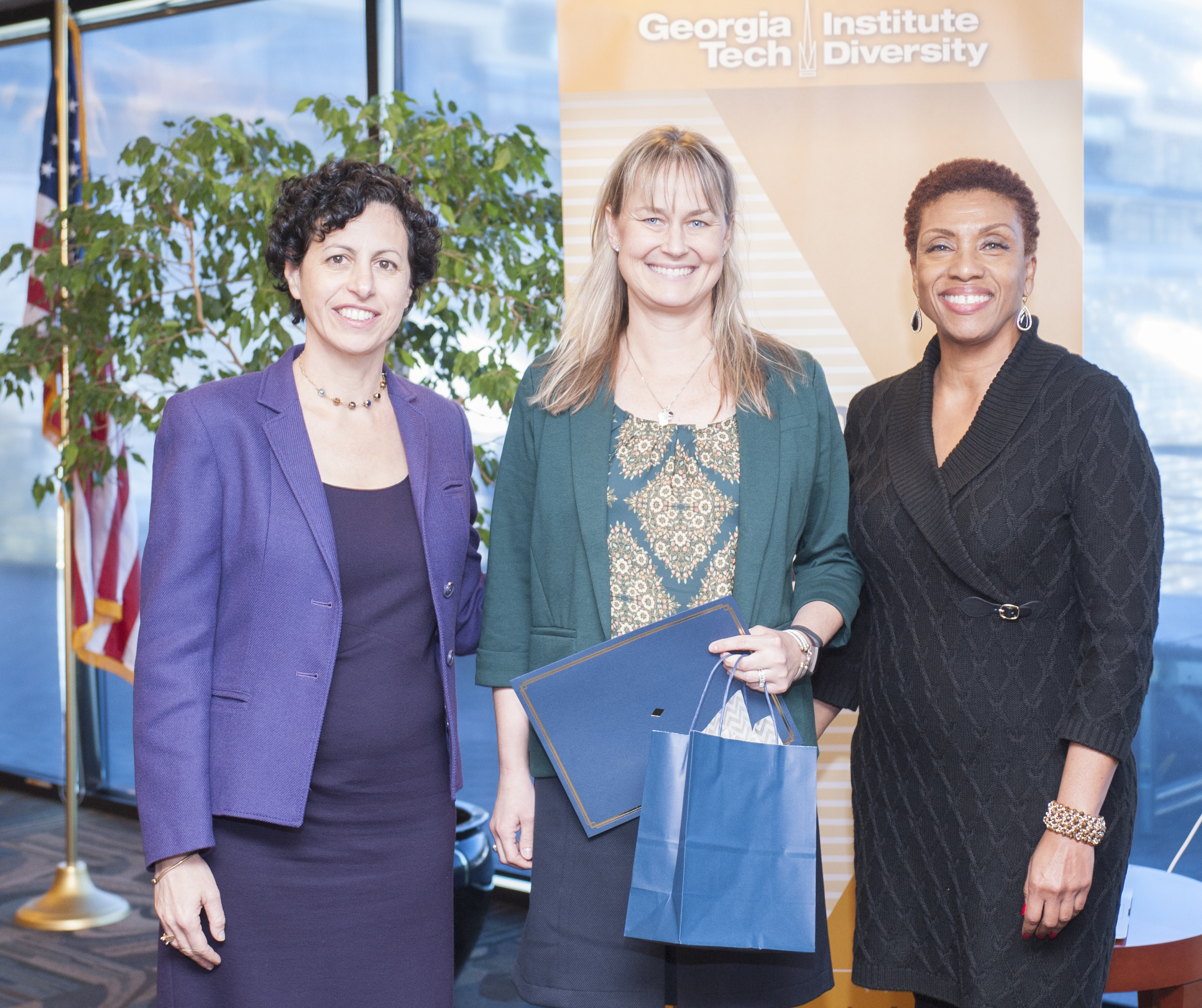 Leading Women@Tech Co-Directors Julie Ancis and Pearl Alexander recognize Lindsay Bryant, director for the Student Center, at the closing ceremony on December 2.