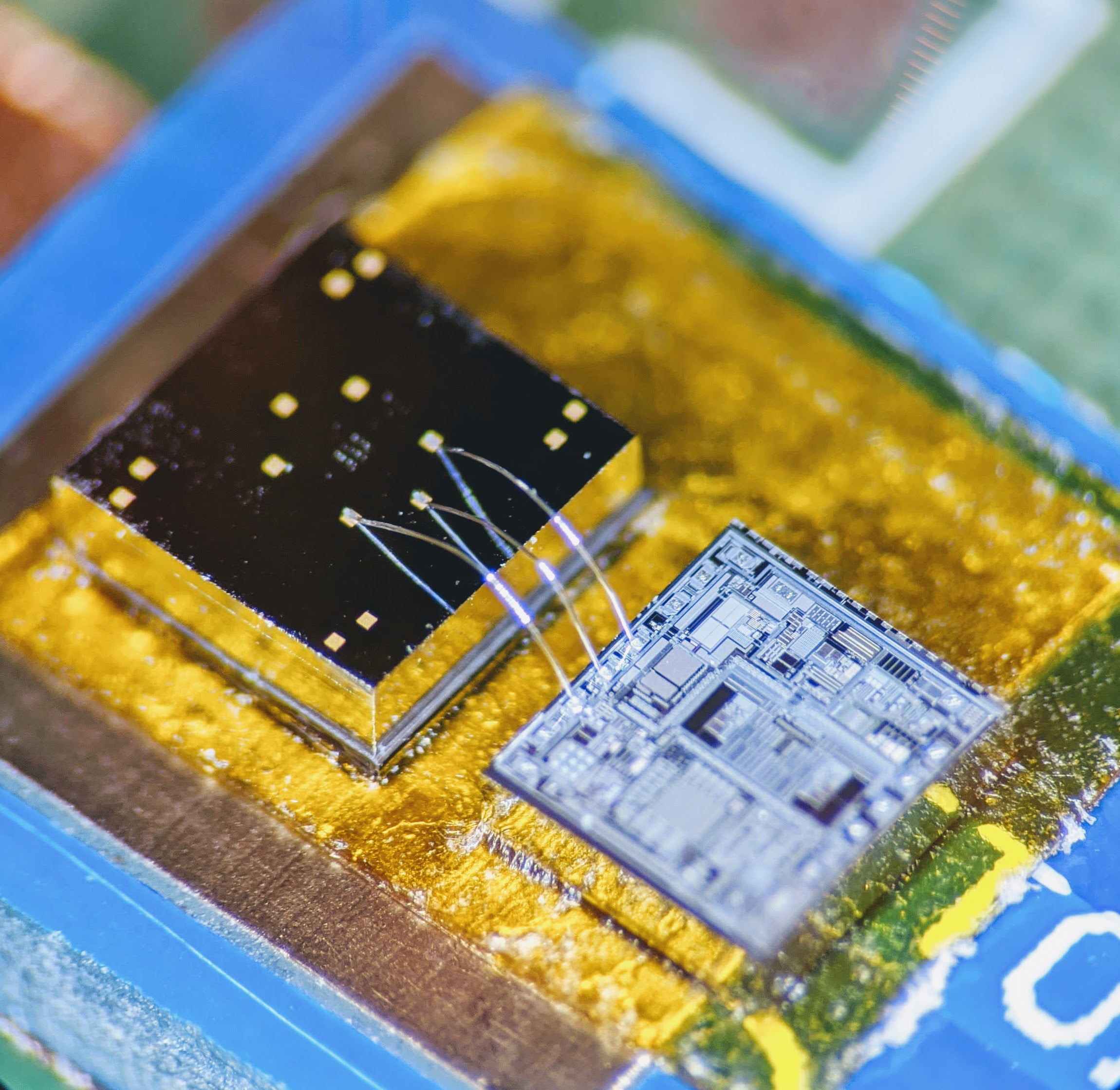 The sensor is a physical chip remarkably attuned to inertia. Next to it, an electronic chip called a signal-conditioning circuit translates the sensor chip’s signals into patterned read-outs. Credit: Georgia Tech / Ayazi lab