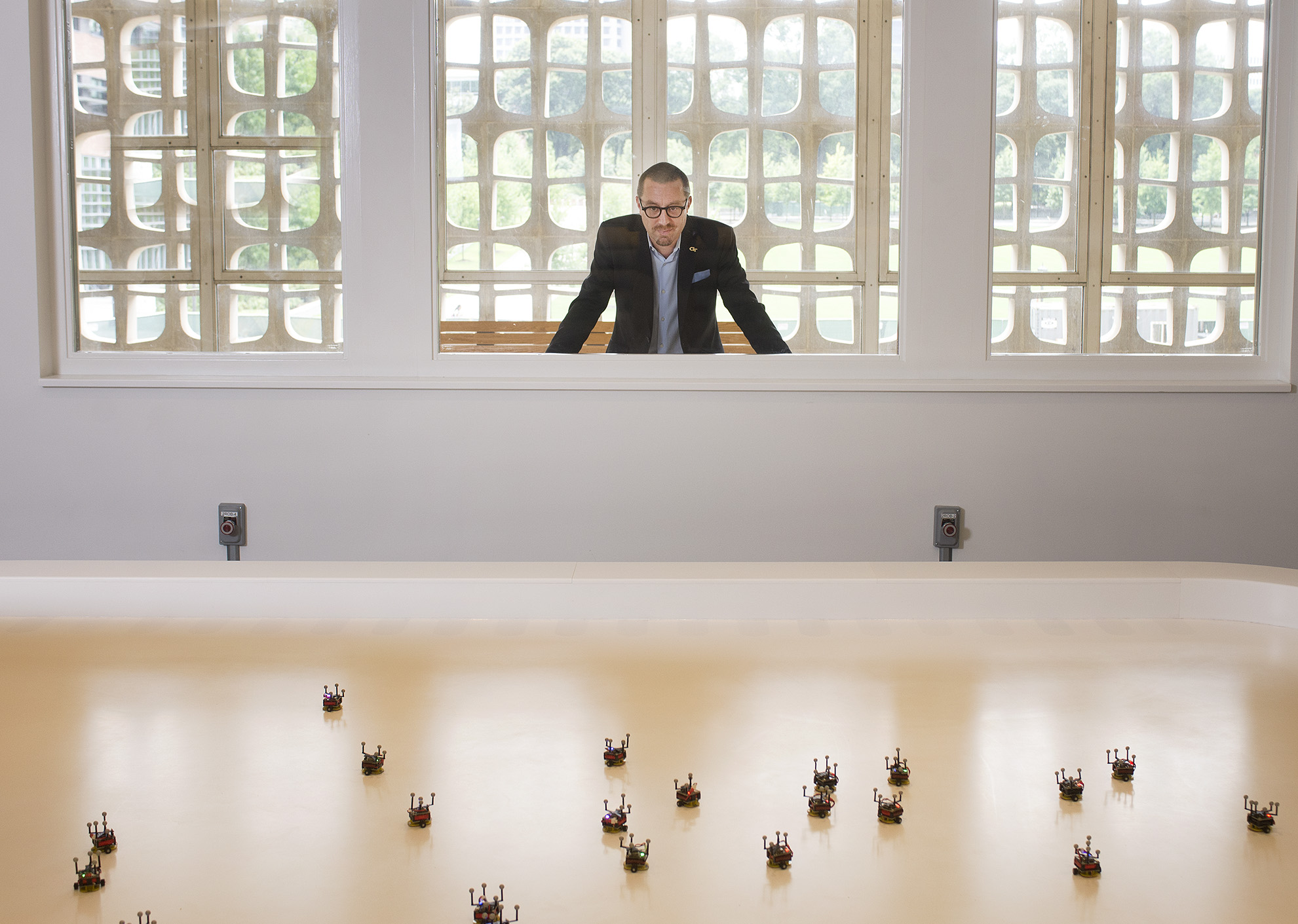 Magnus Egerstedt peers in at his creation: the Robotarium.