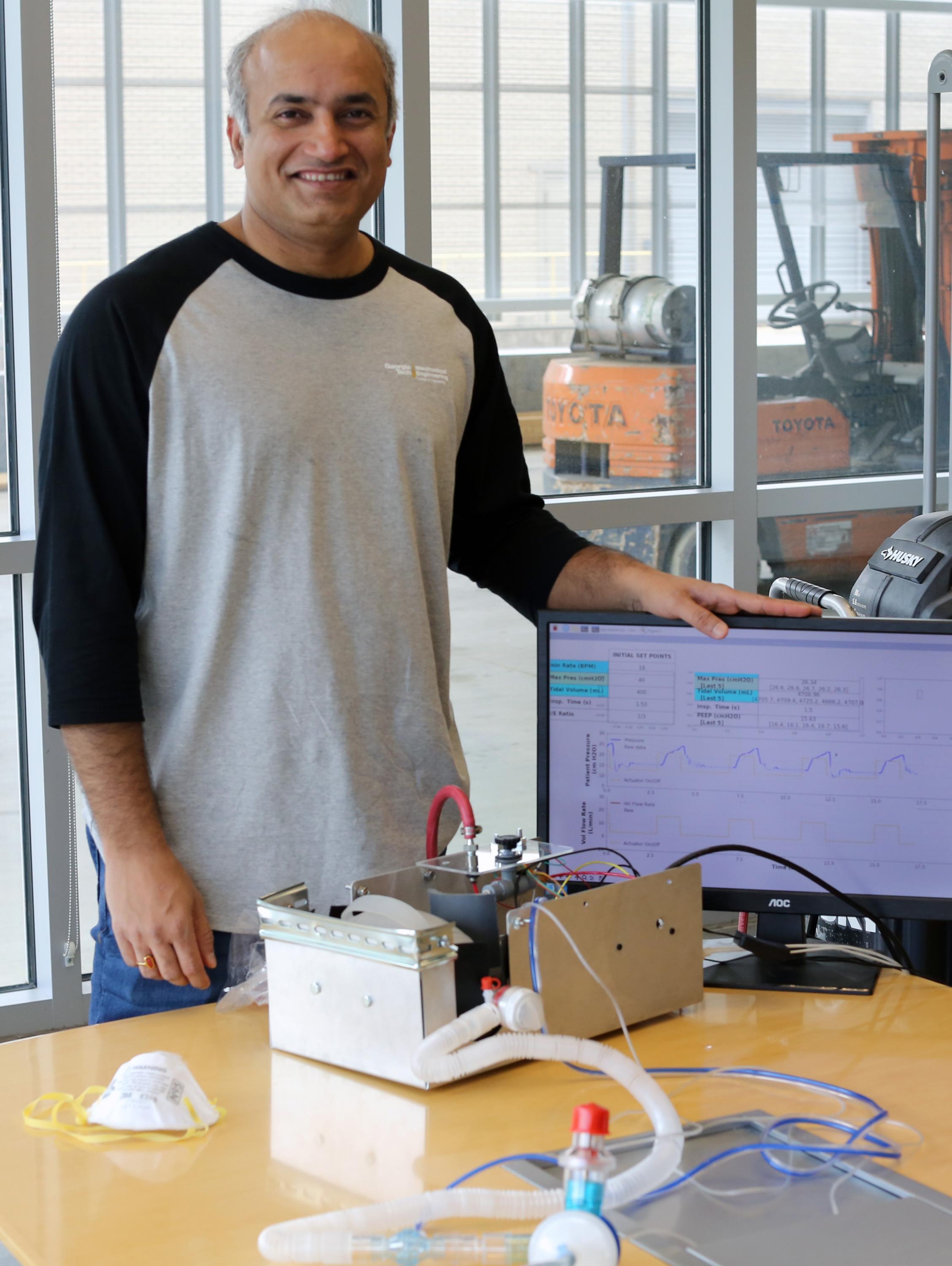 Devesh Ranjan, a professor in Georgia Tech’s George W. Woodruff School of Mechanical Engineering, is shown with the Open-AirVentGT, a low-cost, portable emergency ventilator that uses electronic sensors and computer control to manage key clinical parameters. (Credit: Ben Wright, Georgia Tech)