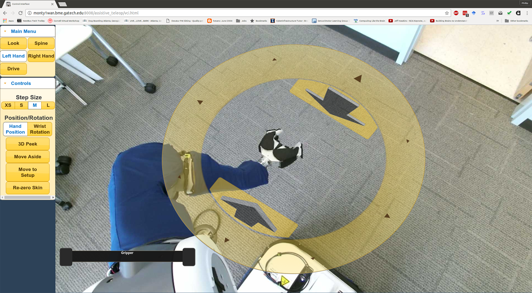 Image shows the view through the PR2’s cameras showing the environment around the robot. Clicking the yellow disc allows users the control the arm. (Credit: Phillip Grice, Georgia Tech)