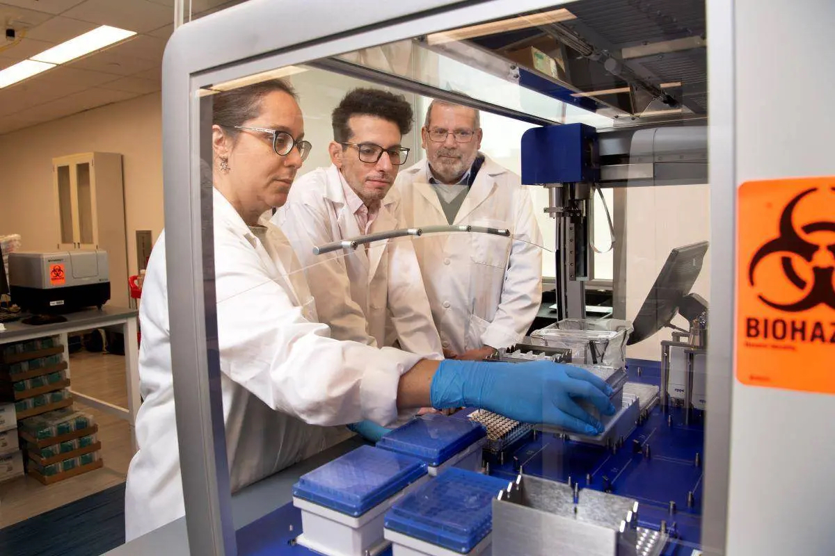 
Researchers, from left, Lorena Chaves, Jose Assumpcao, and Philip Santangelo will be part of a collaborative effort to use mRNA drugs to enhance the body’s immune response. Santangelo is leading the $24 million project supported by the federal Advanced Research Projects Agency for Health. (Photo: Jack Kearse)

