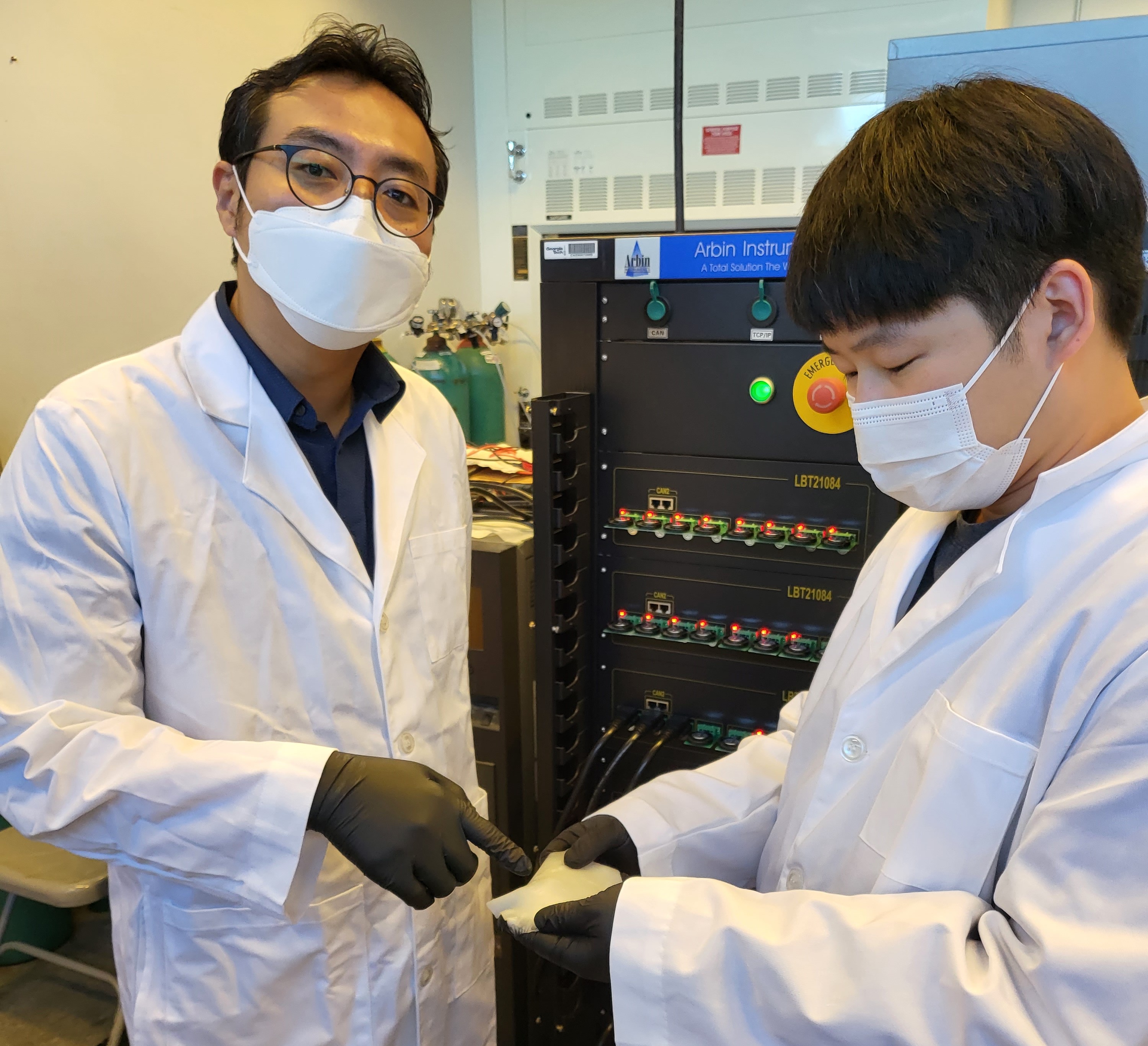 Prof. Seung Woo Lee (left) and Michael J. Lee (right) have demonstrated a more cost-effective, safer solid polymer electrolyte (rubber material) for all-solid-state batteries. (Photo credit: Georgia Tech)