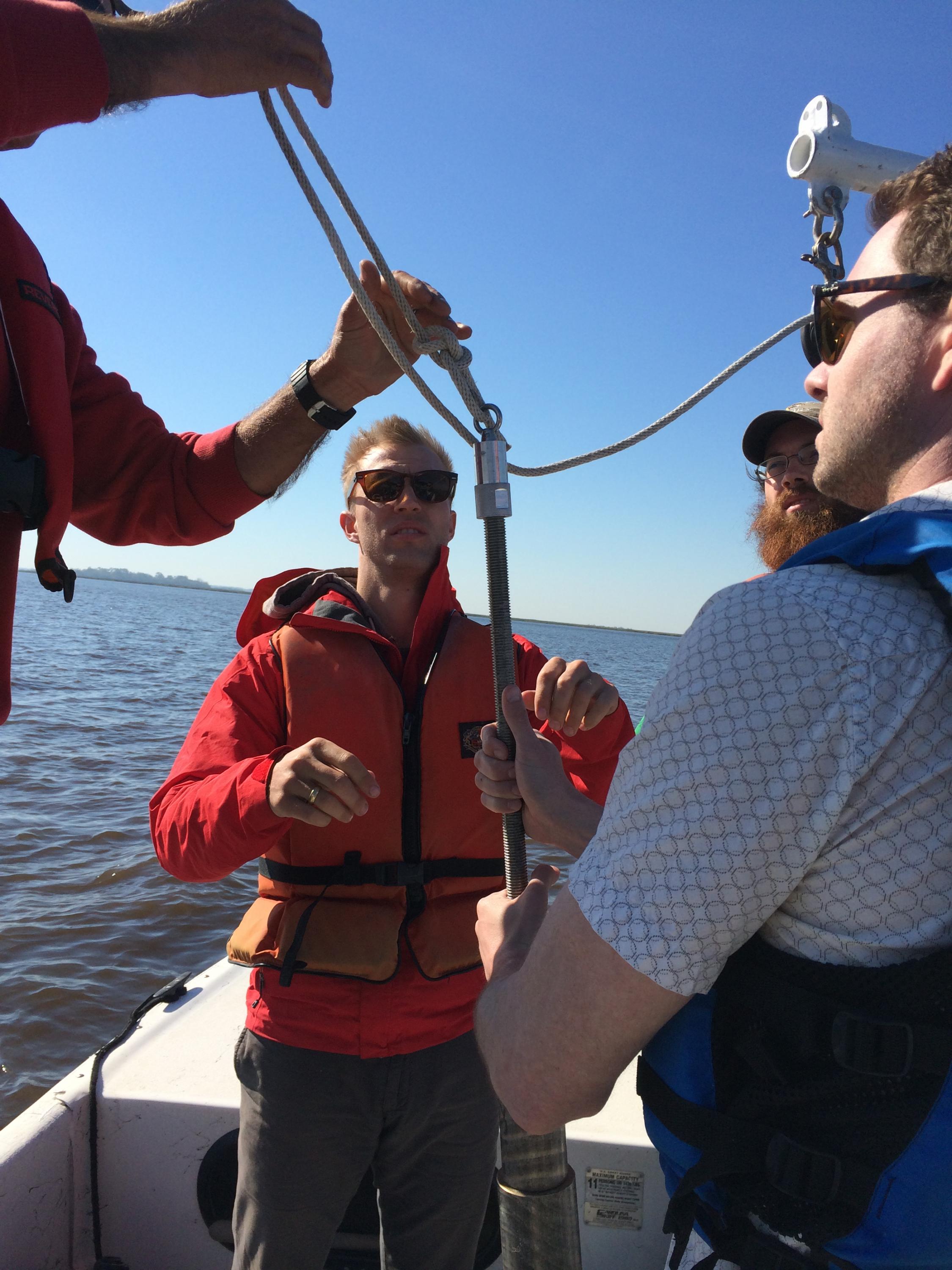 Yale's Noah Planavsky (left) and Georgia Tech's Chris Reinhard (right, front) collecting estuarine sediment core samples with the goal of better understanding how animal life controls phosphorus cycling at the seabed.