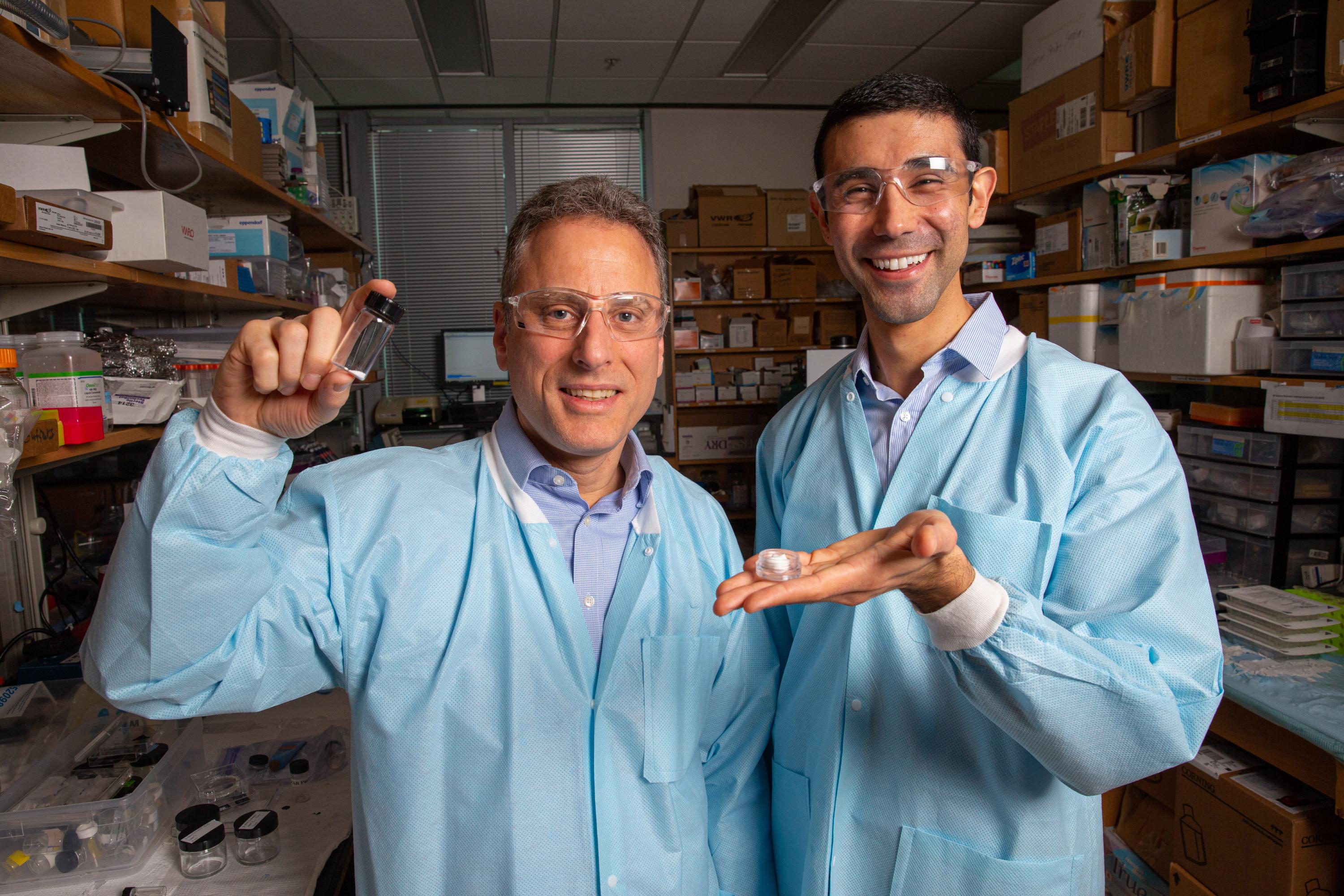 Georgia Tech Professor Mark Prausnitz and Postdoctoral Scholar Andrew Tadros hold samples of the STAR particles, which could potentially facilitate better treatment of skin diseases including psoriasis, warts, and certain types of skin cancer. (Credit: Candler Hobbs, Georgia Tech)