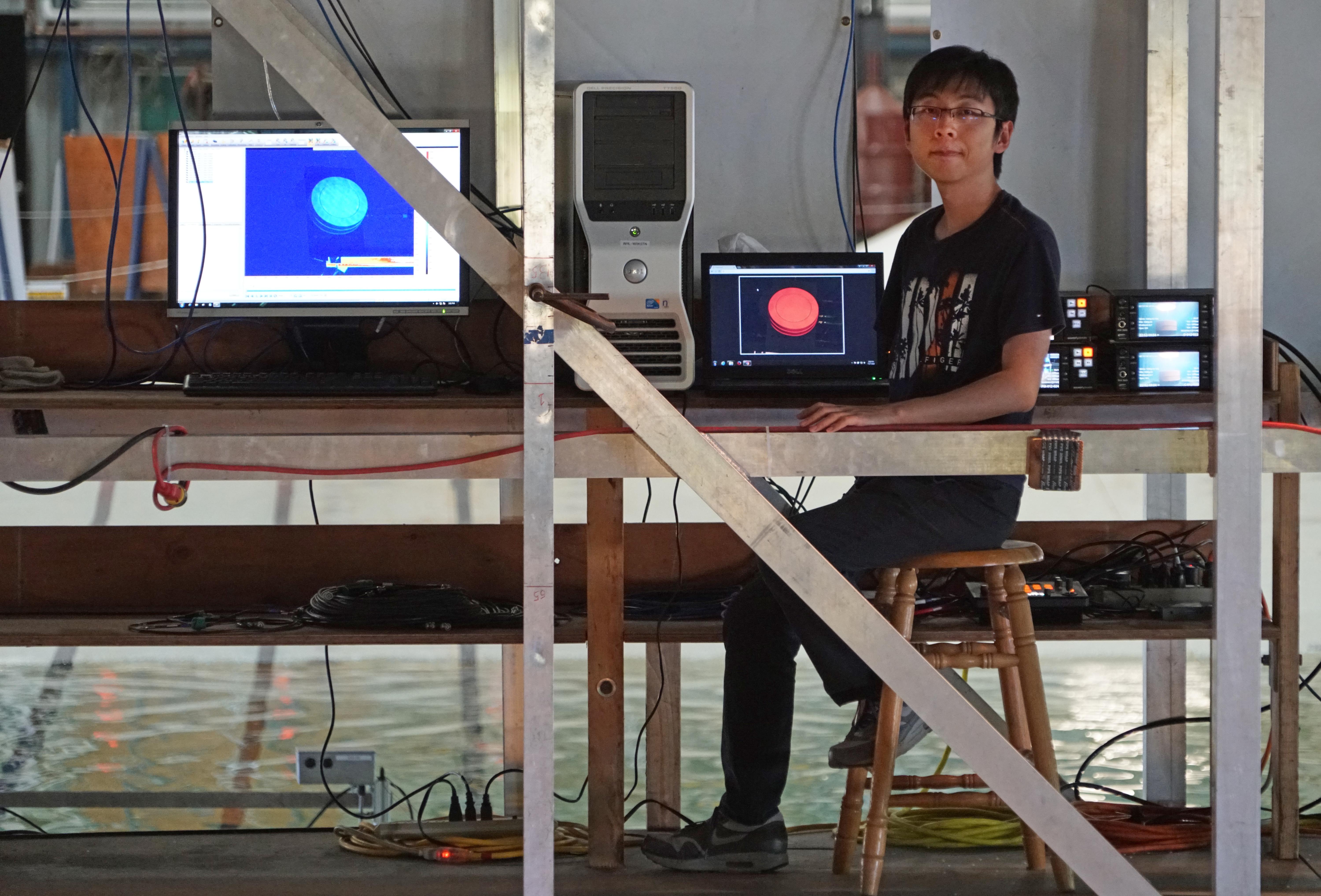 Yibin Liu is at the controls of the volcanic tsunami generator he developed in the lab of Hermann Fritz.
