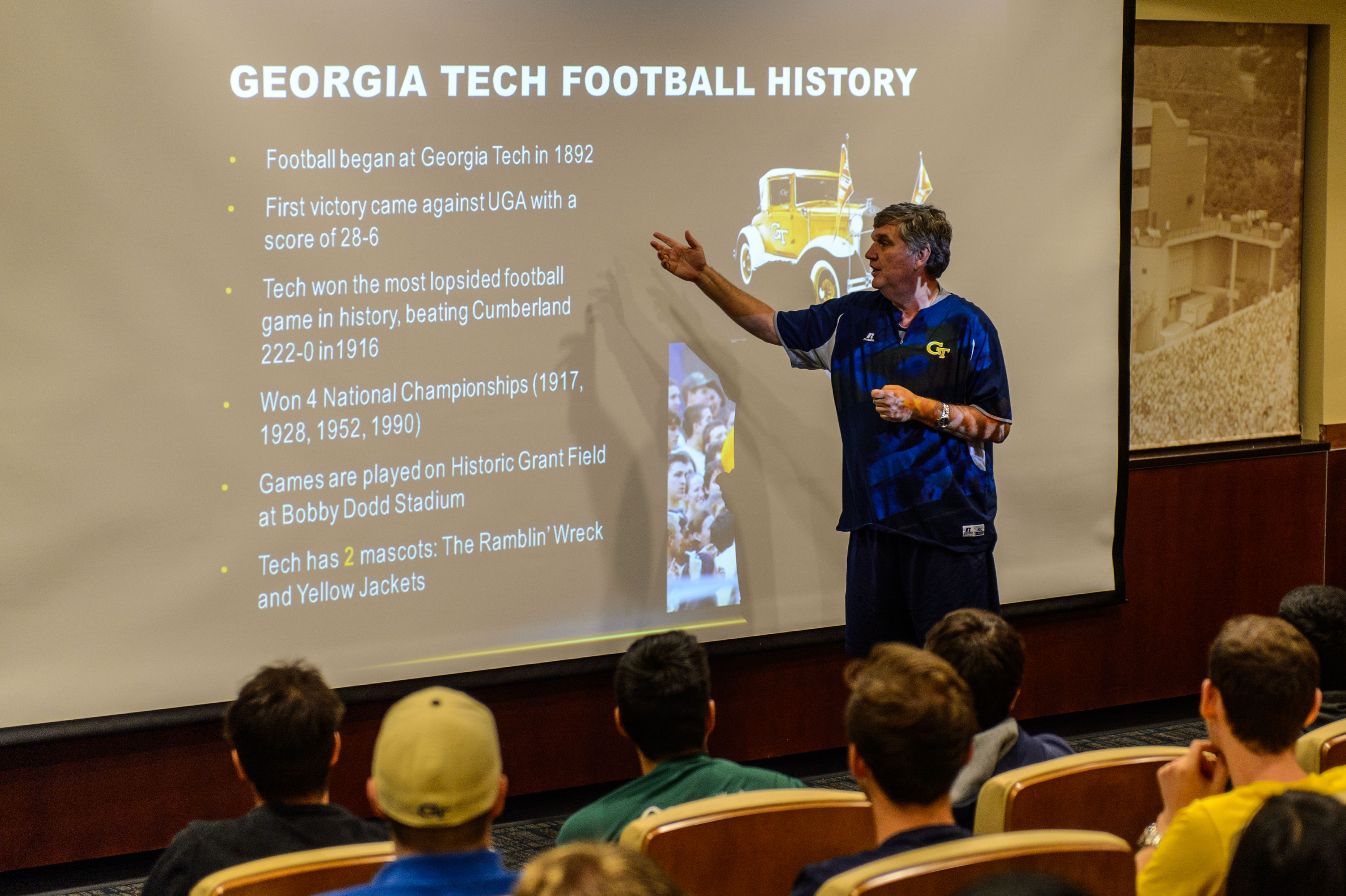 Head Coach Paul Johnson teaches international students the rules of football.