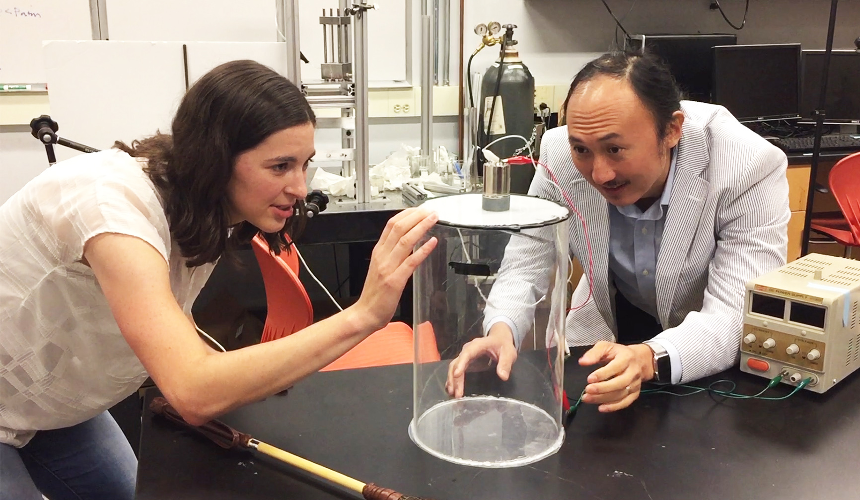 Marguerite Matherne, a mechanical engineering Ph.D. student, and Professor David Hu examine the mammal tail simulator used to study the airflow needed to keep mosquitoes from landing. (Credit: John Toon, Georgia Tech)