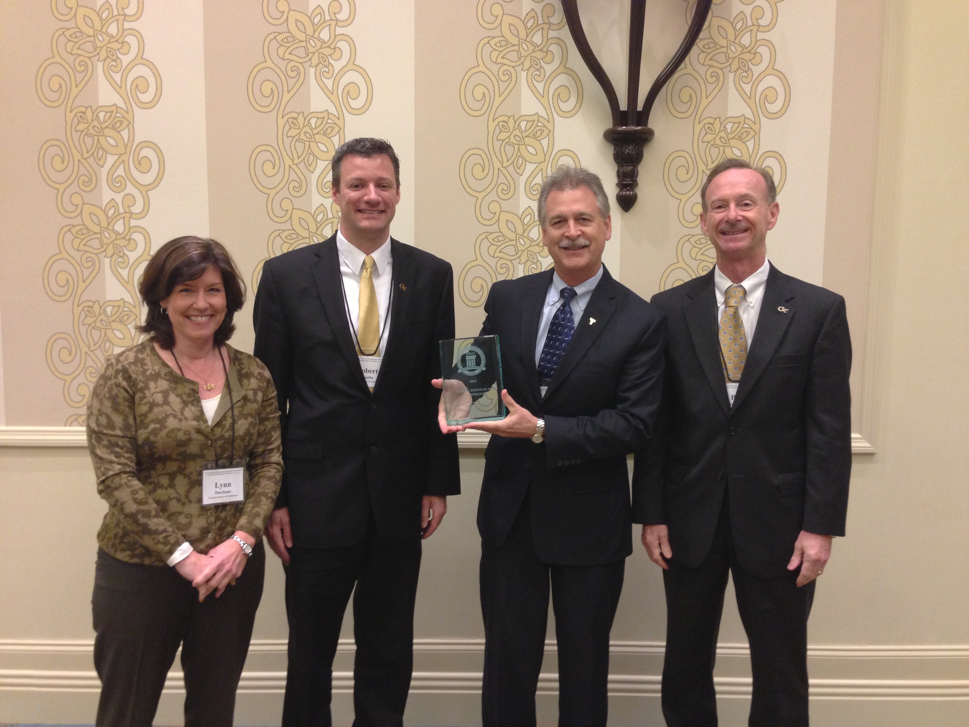 The Georgia Institute of Technology received an "Innovation" award from the Association of Public and Land-grant Universities for its statewide economic development efforts in a number of sectors. Accepting the award are (l-r), Lynn Durham, assistant vice president; Robert Knotts, director of federal relations; Chris Downing, associate vice president, Enterprise Innovation Institute, and William "Bill" Schafer, vice president of student affairs.