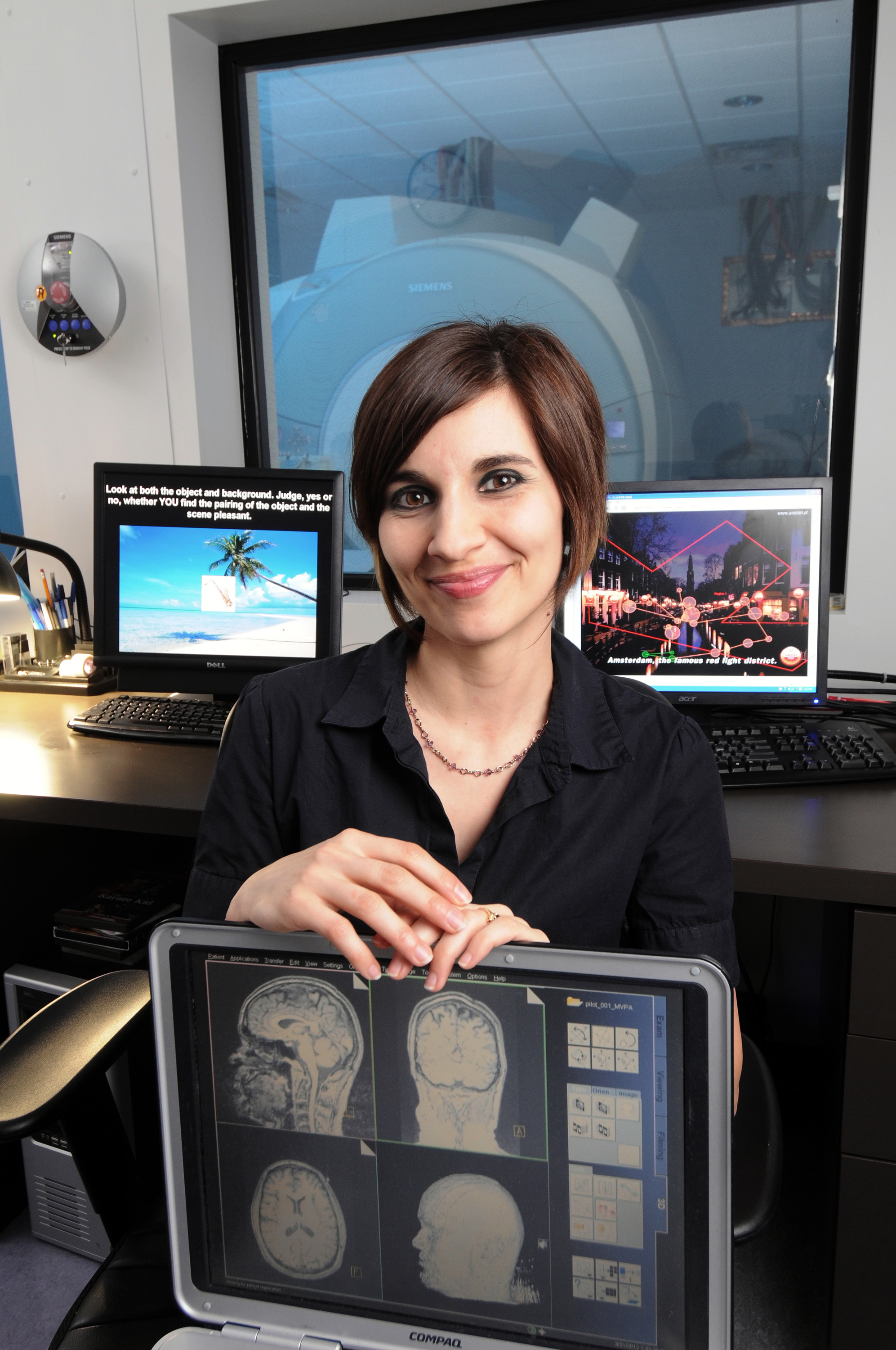 Audrey Duarte, an assistant professor in the School of Psychology, uses the functional MRI scanner at the Georgia State/Georgia Tech Center for Advanced Brain Imaging to measure activity from thousands of neurons in the brain at the same time while subjects try to retrieve episodic memories. (Georgia Tech Photo: Gary Meek)