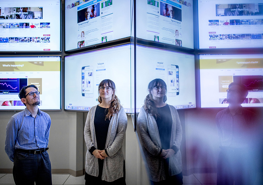 Researchers Erica Briscoe and Zsolt Kira are creating a high-performance system that automatically detects real-world events across multiple news sources — and could ultimately help forecast future behavior. (Credit: Branden Camp, Georgia Tech)