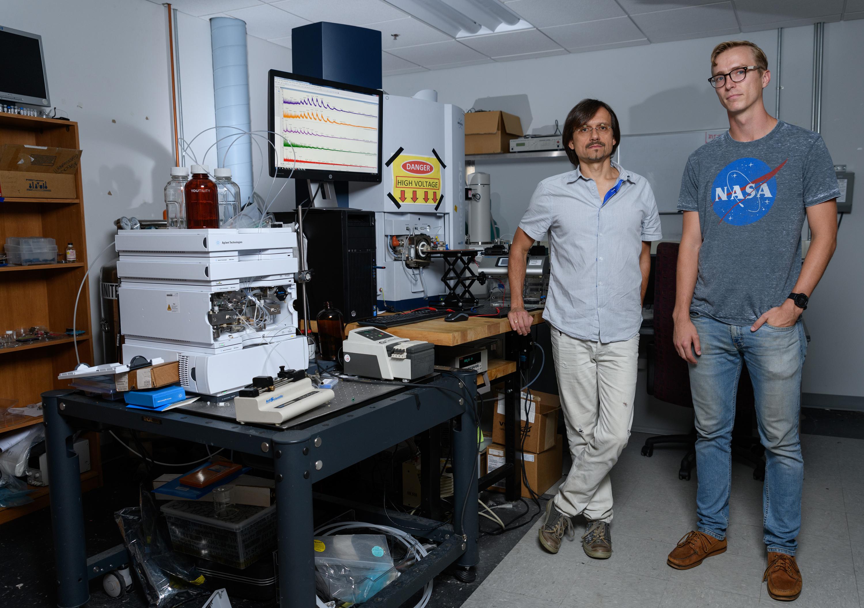 Georgia Tech researchers Andrei Fedorov and Mason Chilmonczyk are shown in a testing laboratory used to evaluate their Dynamic Mass Spectrometry Probe, which was developed to monitor the health of living cell cultures. (Credit: Rob Felt, Georgia Tech)