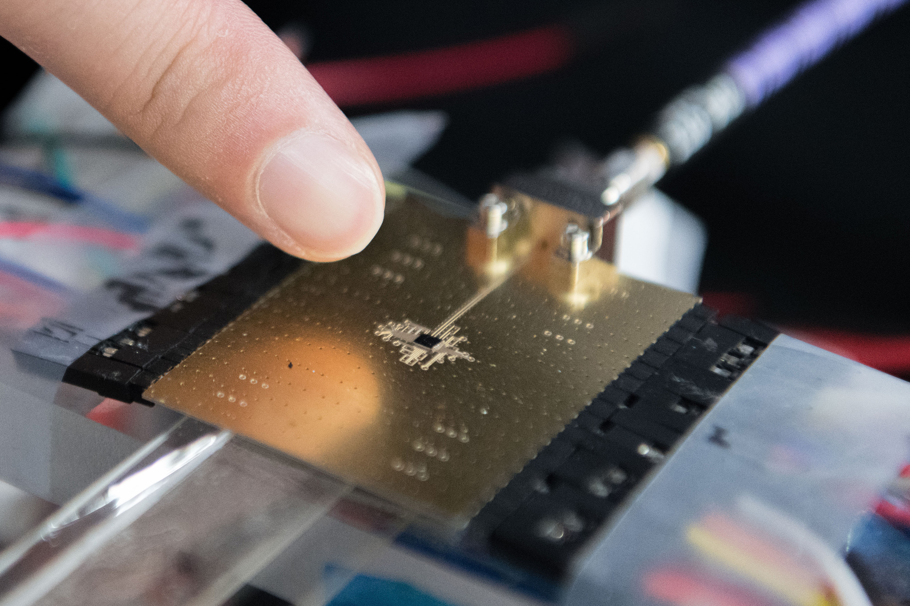 Image shows one of the packaged millimeter wave transmitters with antenna-electronics co-designed collaboratively by the Georgia Tech researchers. The ultra-miniaturized IC chip contains on-chip antenna and all the required electronics for millimeter wave signal generation and transmitting. Multiple IC chips can be tiled together to form a large array for 5G MIMO applications. (Credit: Allison Carter, Georgia Tech)