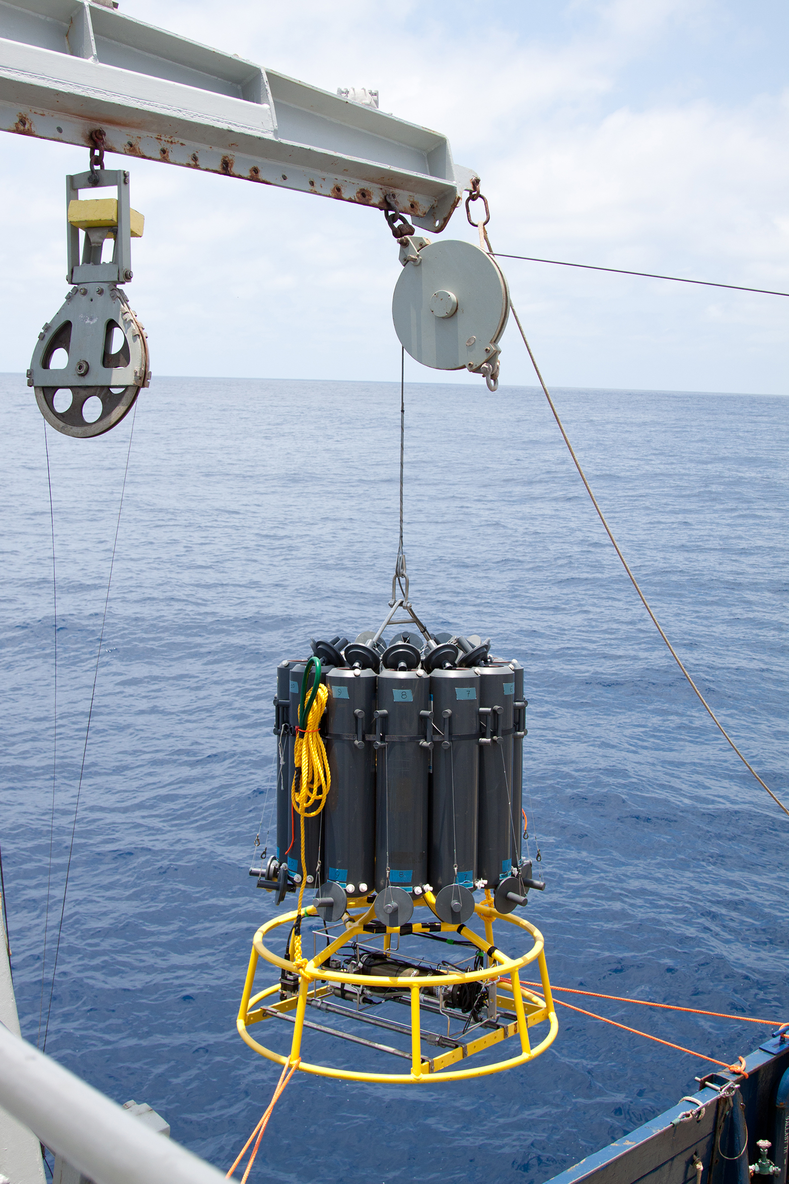 A carrousel of collector tubes dangles from a crane before beginning its descent to the oxygen minimum zone off of Mexico's Pacific coast. Credit: Dr. Heather Olins