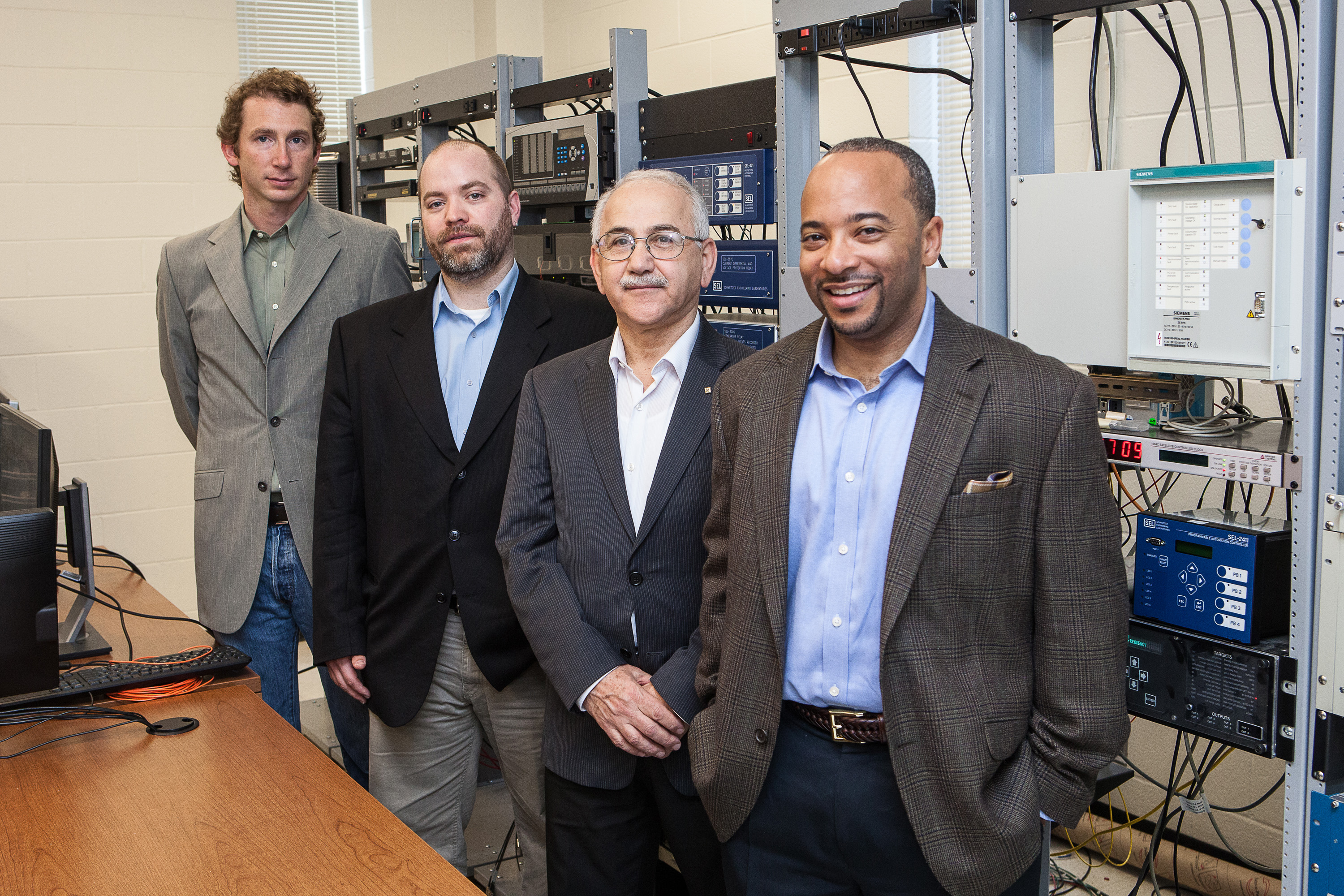 The Department of Energy has awarded Georgia Tech $1.7 million to help detect cyber attacks on our nation’s utility companies. From front to back are School of Electrical and Computer Engineering Associate Professor Raheem Beyah, Georgia Power Distinguished Professor A. P. “Sakis” Meliopoulos, National Electric Energy Research, Testing and Applications Center Research Engineer Carson Day and Georgia Tech Research Institute Research Scientist Seth Walters. Not pictured is Associate Director for Electri