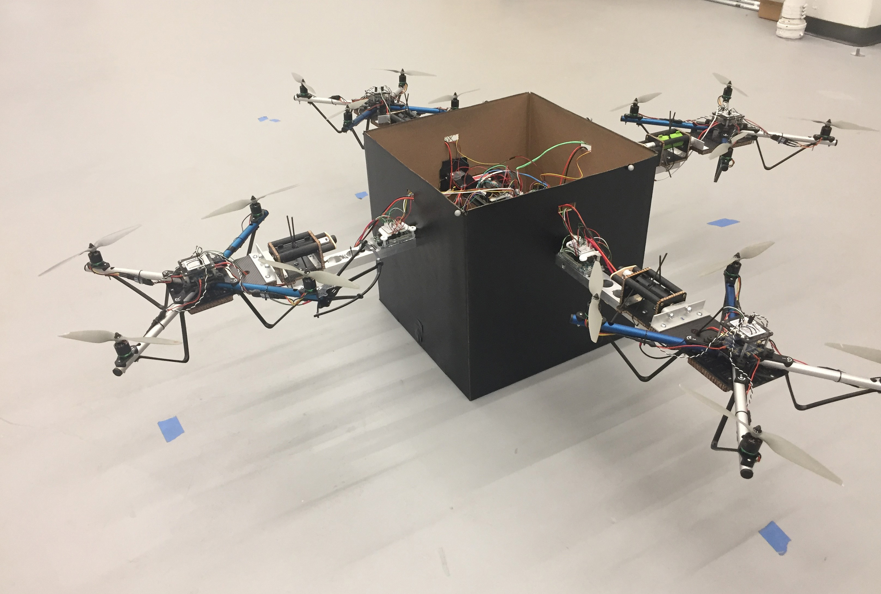 Researchers have developed a modular solution for handling larger packages without the need for a complex fleet of drones of varying sizes. By allowing teams of small drones to collaboratively lift objects using an adaptive control algorithm, the strategy could allow a wide range of packages to be delivered using a combination of several standard-sized vehicles. (Credit: John Toon, Georgia Tech)