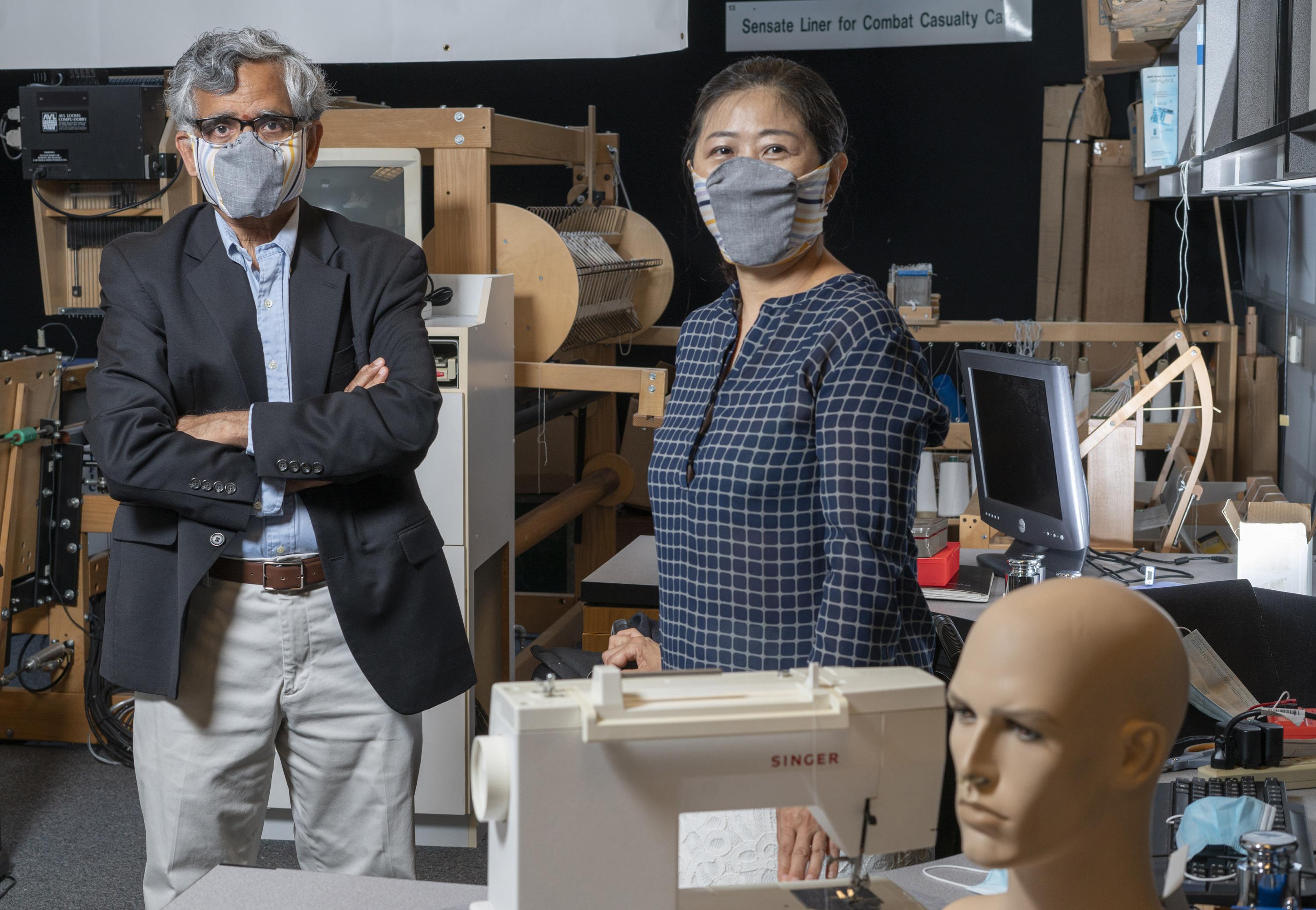 Georgia Tech professor Sundaresan Jayaraman and principal research scientist Sungmee Park wear prototypes of their redesigned face mask. (Credit: Christopher Moore, Georgia Tech).