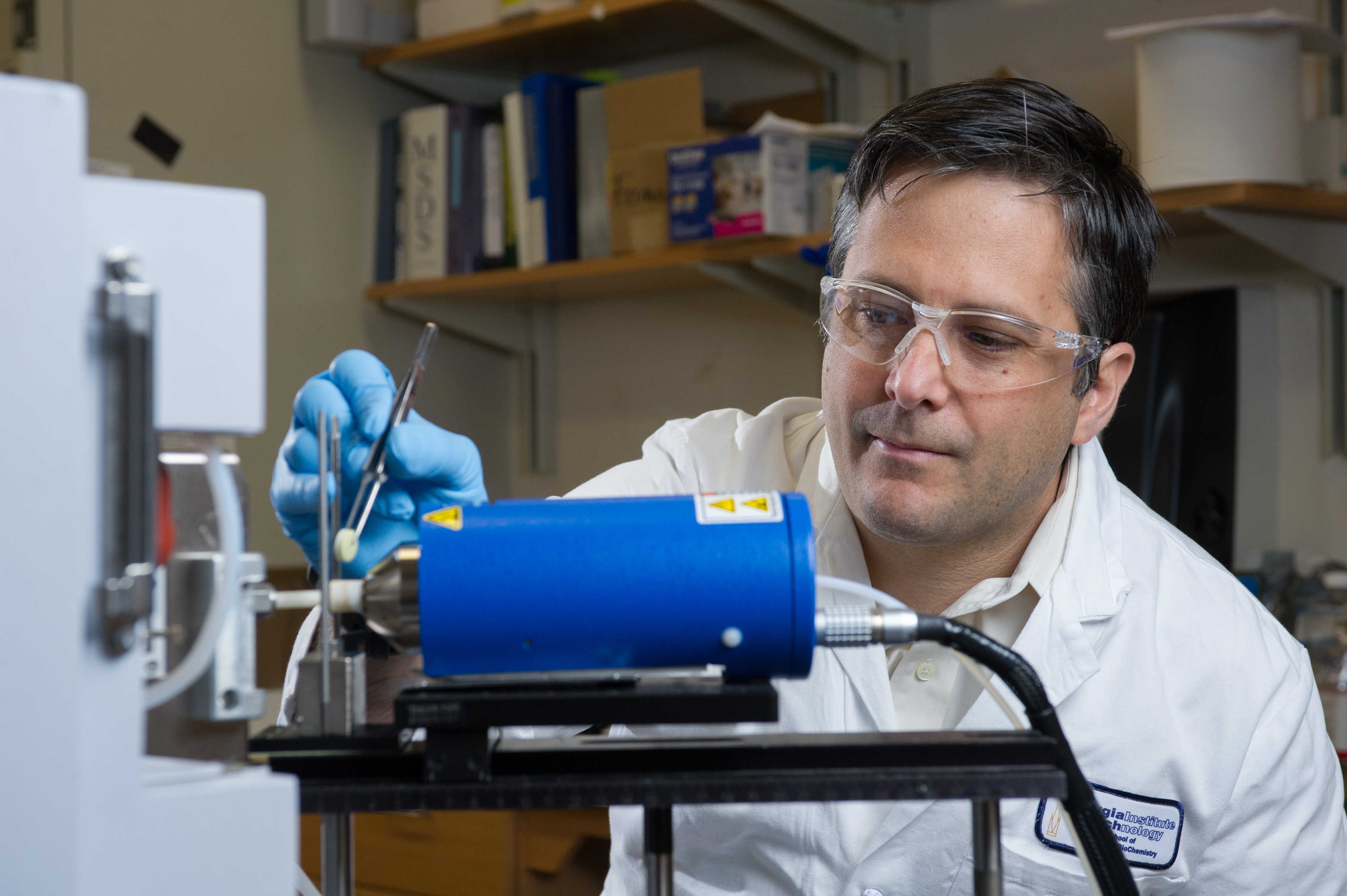 Facundo M. Fernández, a professor in the School of Chemistry and Biochemistry, examines an emergency contraceptive pill with ambient mass spectrometry.