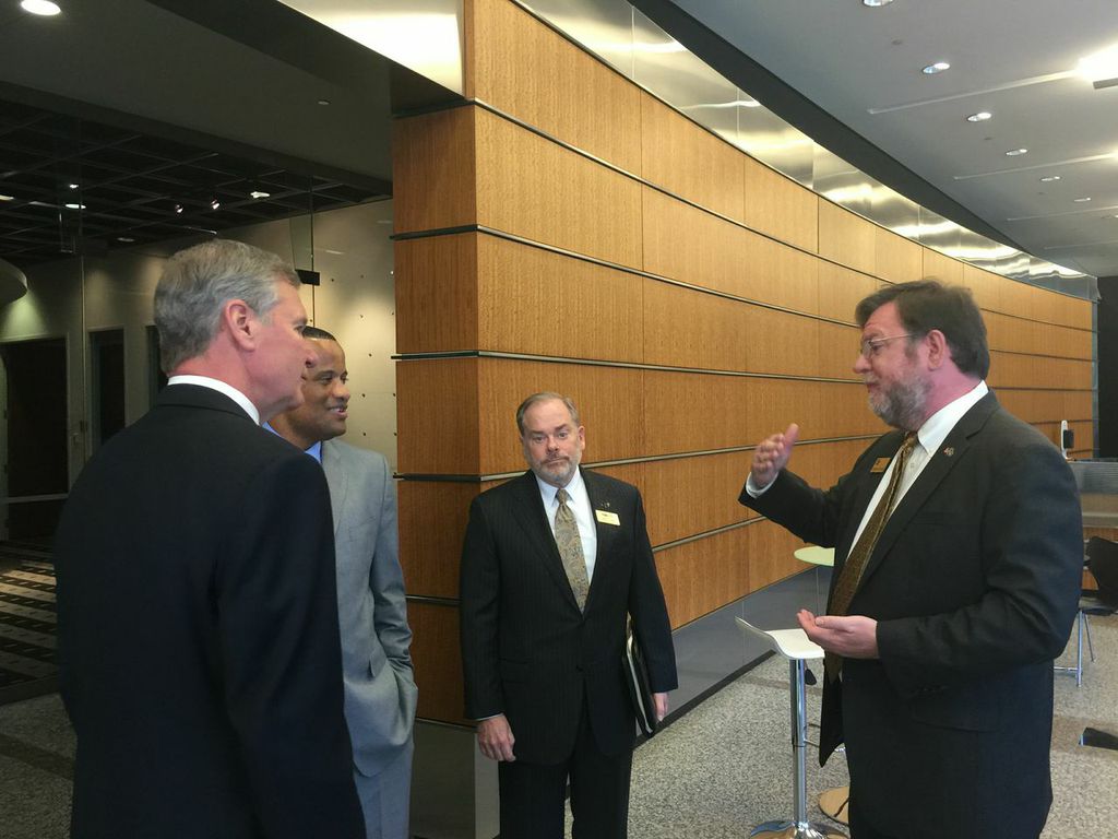 Stephen Fleming (right), vice president of Georgia Tech's Enterprise Innovation Institute, discusses the innovation ecosystem at Tech Square with Jay Williams, (second from left), the assistant secretary of commerce for economic development at the U.S. Department of Commerce. Williams, who was joined by Georgia Tech President G.P. "Bud" Peterson (left) and Steven Cross (center), executive vice president of research at Tech, visited the Institute to make an announcement about a $500,000 i6 Challenge grant th