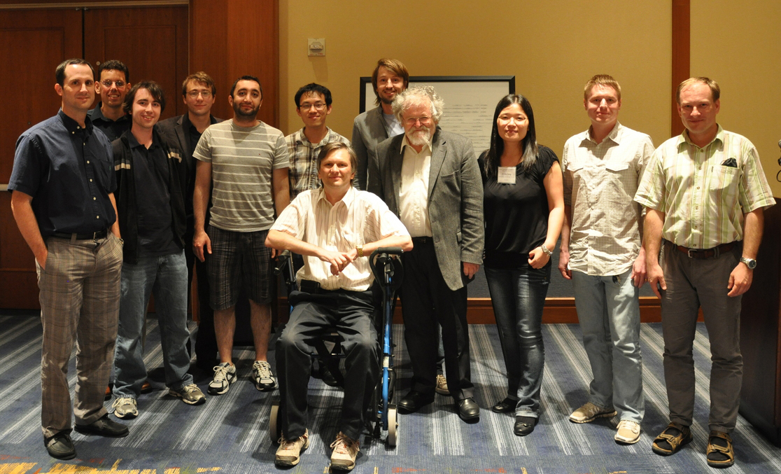 Thomas, center, is pictured with his advisor and some of his former students at a conference held in his honor in 2012. The Conference on Graph Theory took place at Georgia Tech to celebrate Thomas’ work and his 50th birthday. 