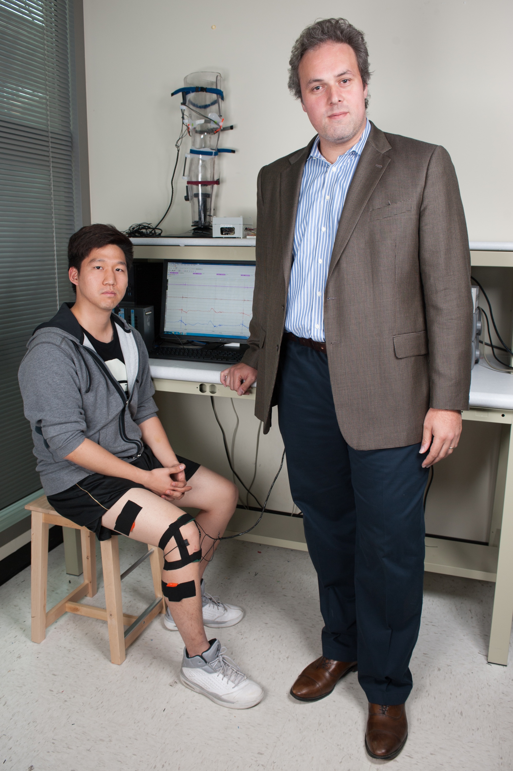 Former NCAA discuss thrower Prof. Omer Inan is working on a knee band that listens to crunchy sounds coming from the joint. Acoustic electronics turn them into moving graphs that may someday be medically useful.