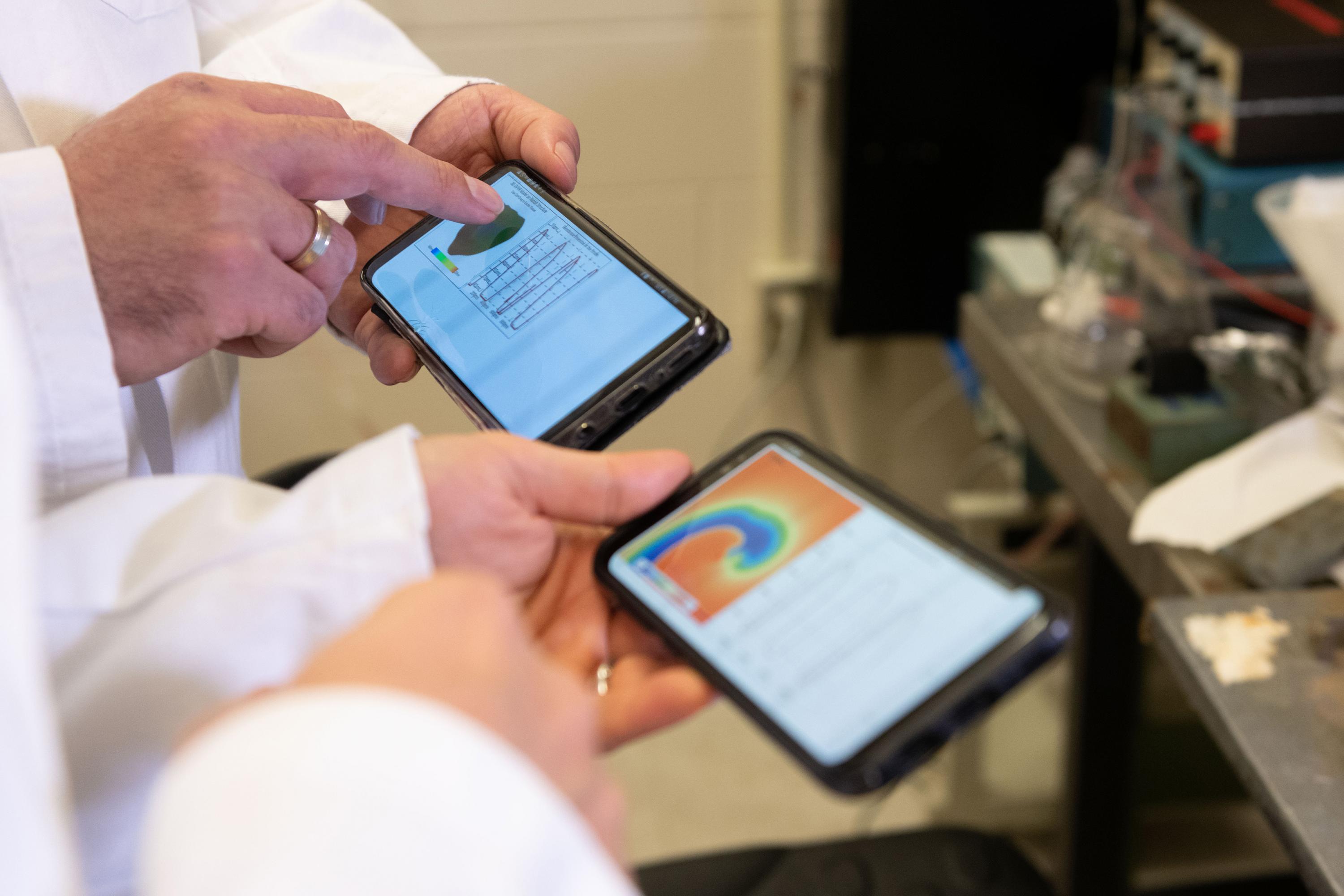 Smartphone screens show cardiac arrhythmia simulations running on the graphics processing units of the mobile devices using the new software. (Photo: Allison Carter, Georgia Tech)