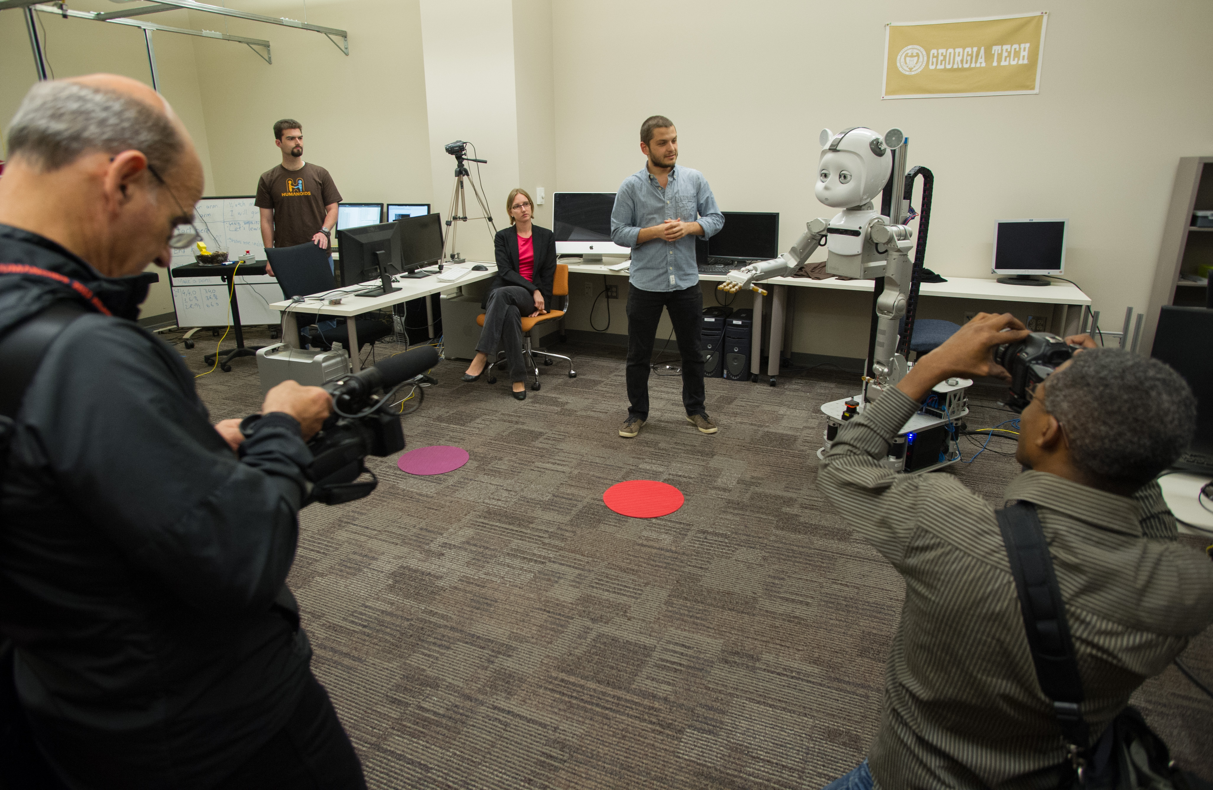 Roboticists from around the world visit Simon while touring Georgia Tech labs during the Humanoids 2013 conference.