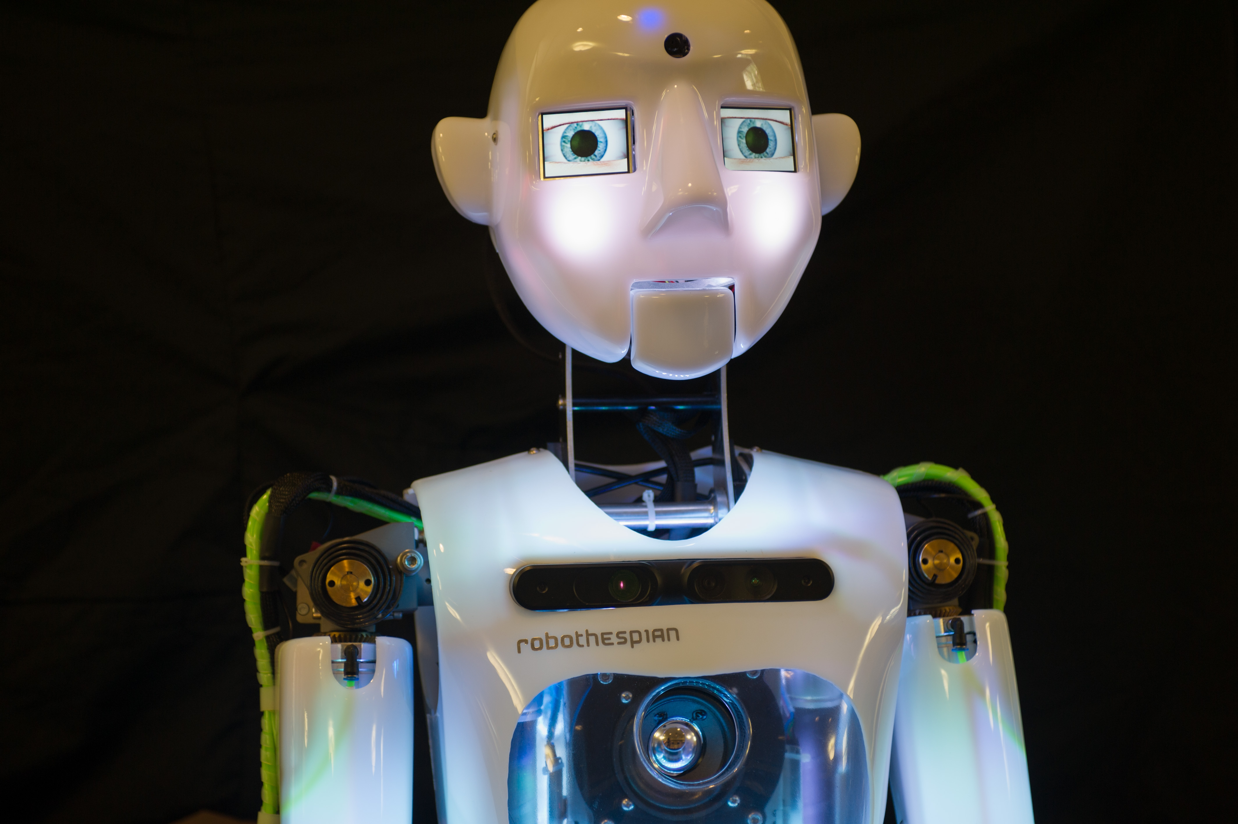 RoboThespian, a humanoid created in the United Kingdom, is designed for human interaction in a public environment. It is fully interactive and multilingual. It is one of several robots on display at Georgia Tech during the Humanoids 2013 conference.