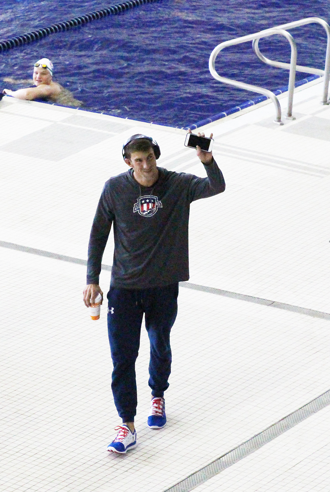 Michael Phelps waves to fans at an open practice at Georgia Tech's McAuley Aquatic Center on July 30, 2016