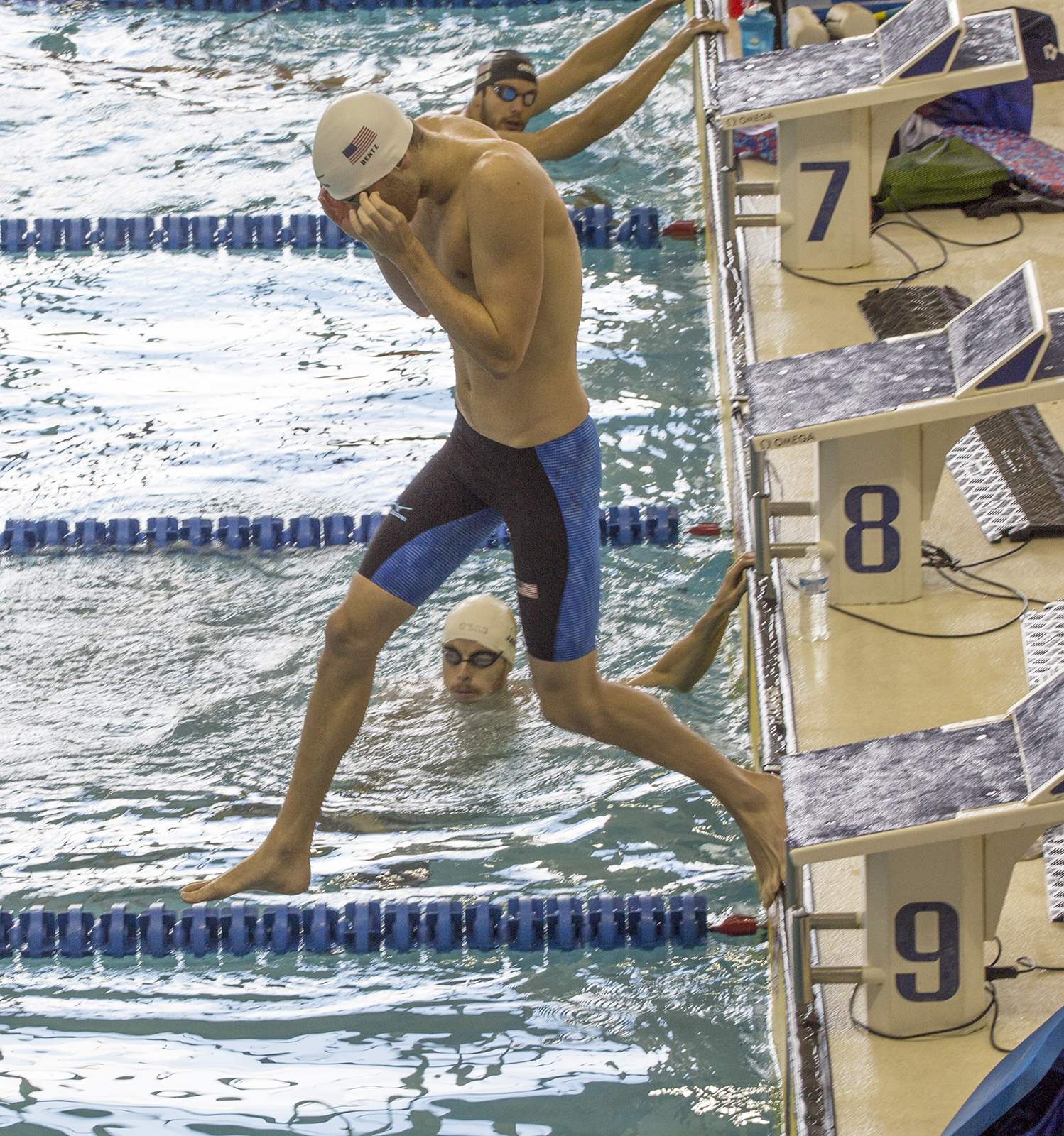 Gunnar Bentz jumps into the pool at the McAuley Aquatic Center on July 30, 2016