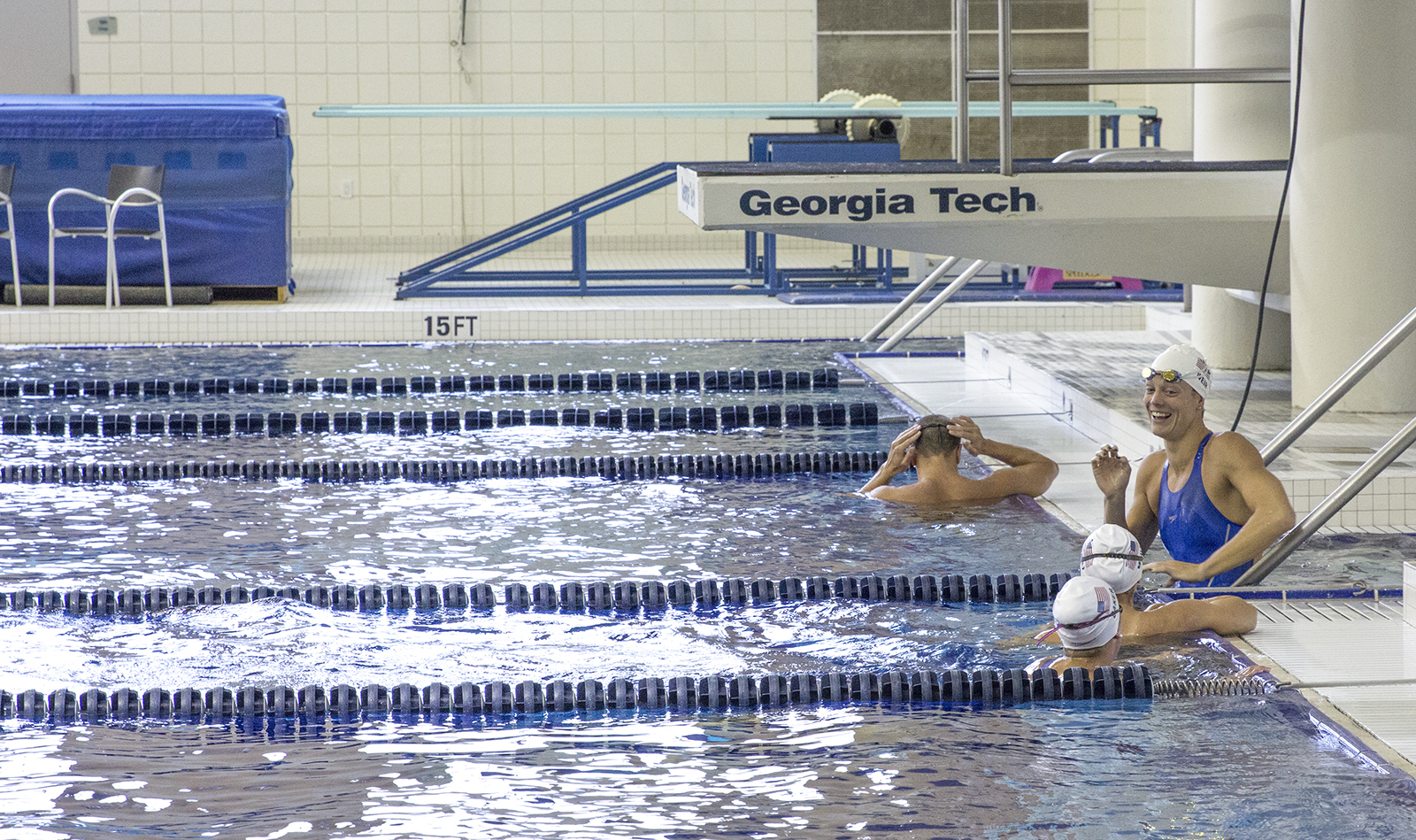Amanda Weir talks with teammates at an open Olympic practice session at the McAuley Aquatic Center on July 30, 2016