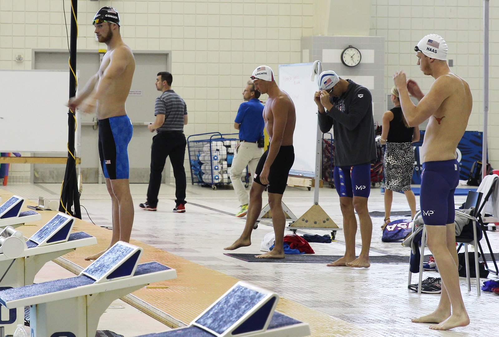 Jack Conger, Ryan Lochte, Michael Phelps, and Townley Haas prepare to swim at an open practice at Georgia Tech's McAuley Aquatic Center on July 30, 2016