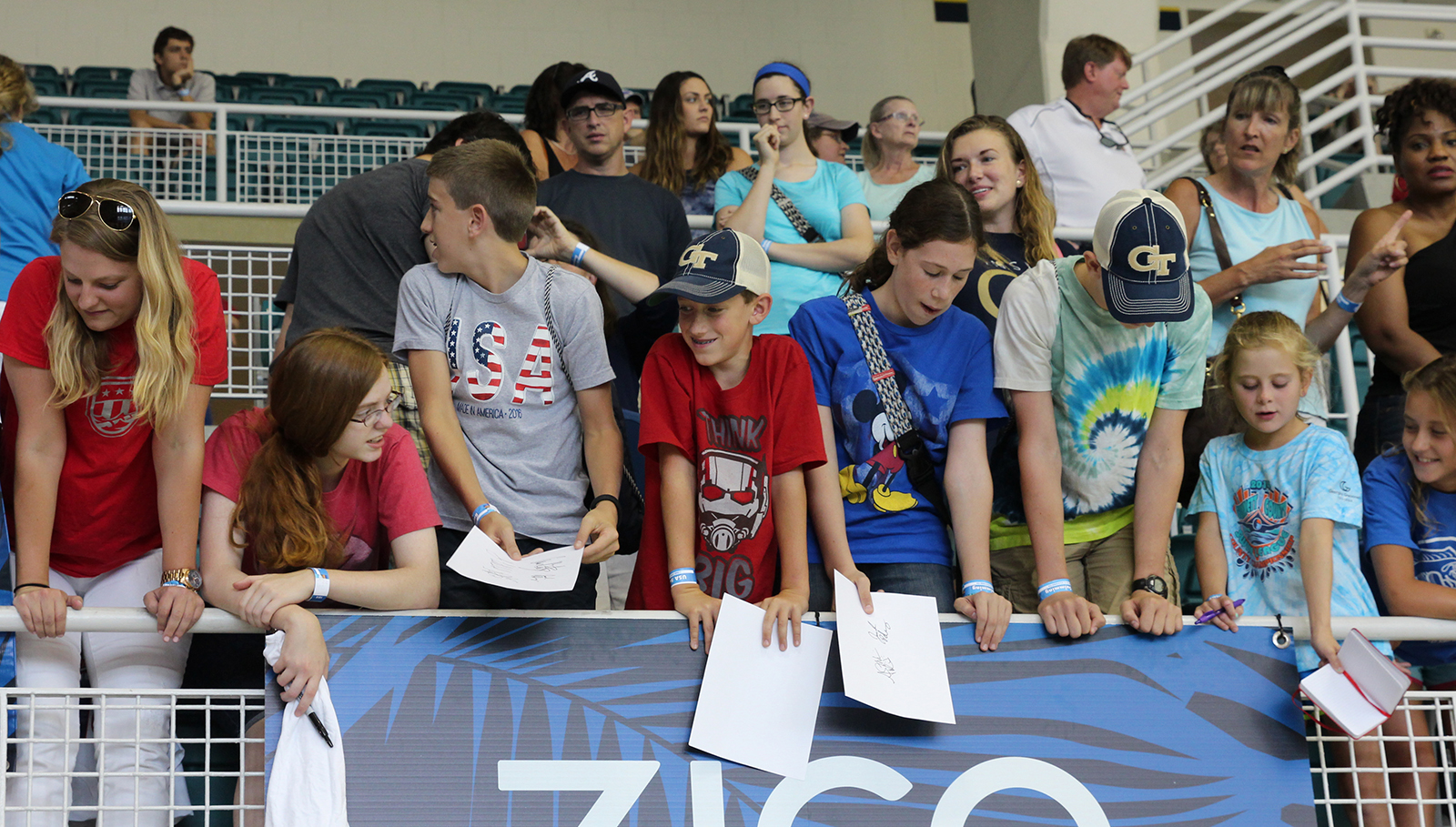 Fans wait for autographs at an open Olympic swimming practice at Georgia Tech's McAuley Aquatic Center on July 30, 2016