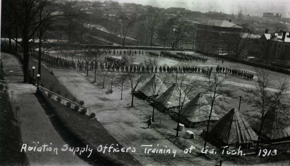 pic of tech tower lawn with army aviation tents and white oak by staircase