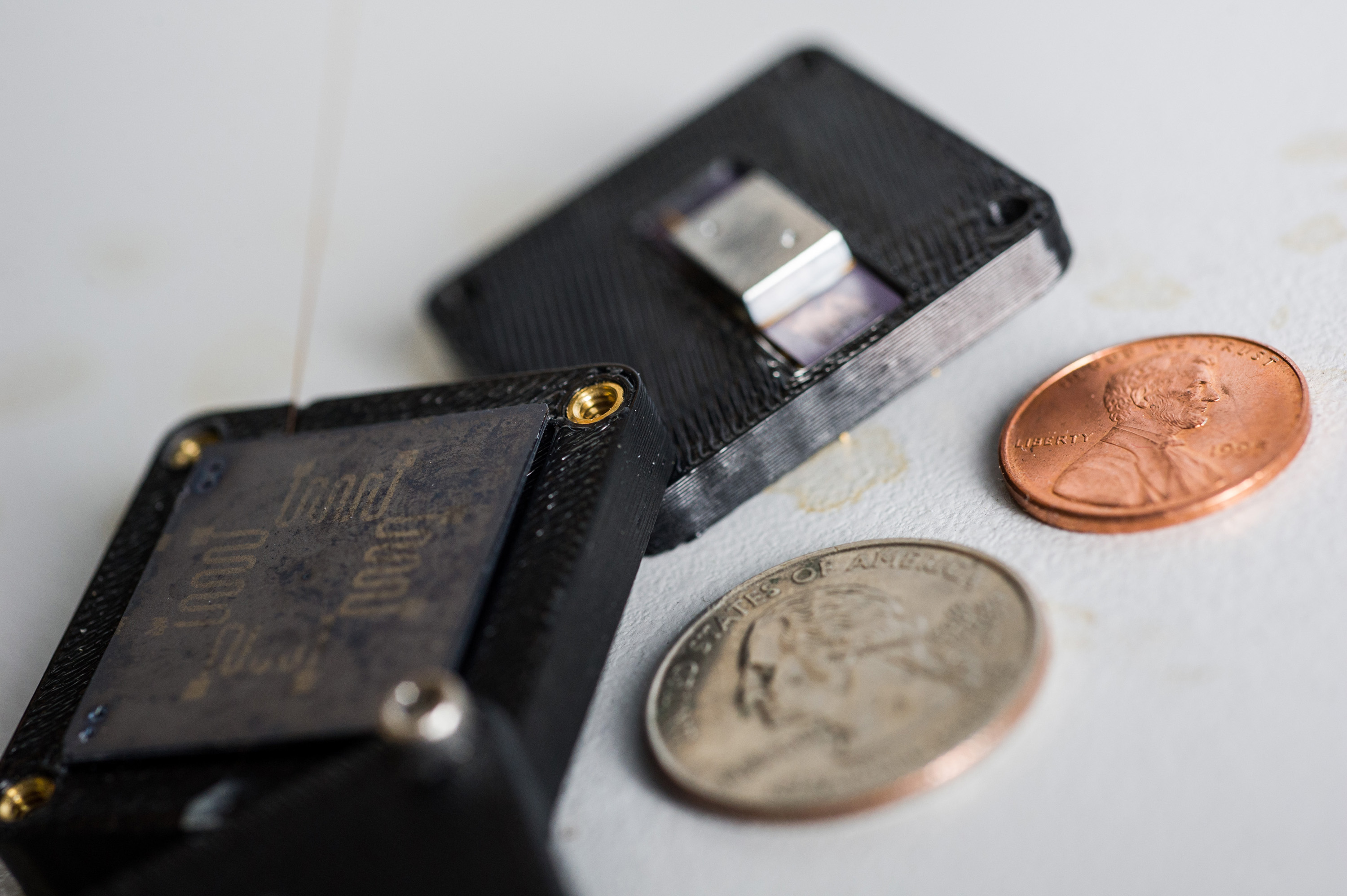 GTRI’s micro gas chromatograph is a GC-on-chip device. Its separation column, where the gas interacts with the polymer coated on the interior walls, is about the size of a quarter, and the thermal conductive detector is about half the size of a penny. When the two are combined, the device itself is about the size of a 9-volt battery. (Georgia Tech Photo: Rob Felt)