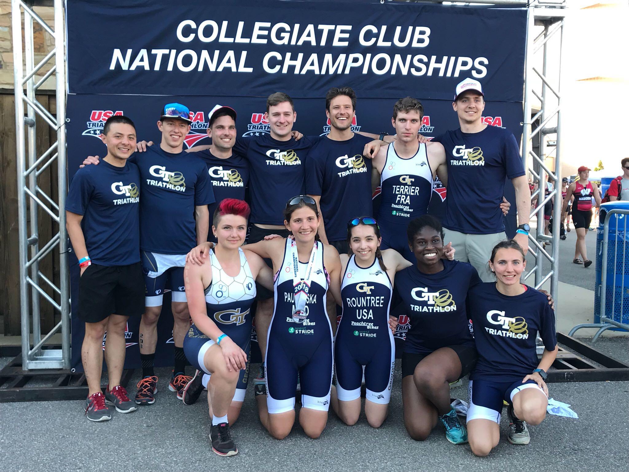 The Triathlon Club poses in front of a banner at the 2018 National Championships (Photo: GT Triathlon Club).
