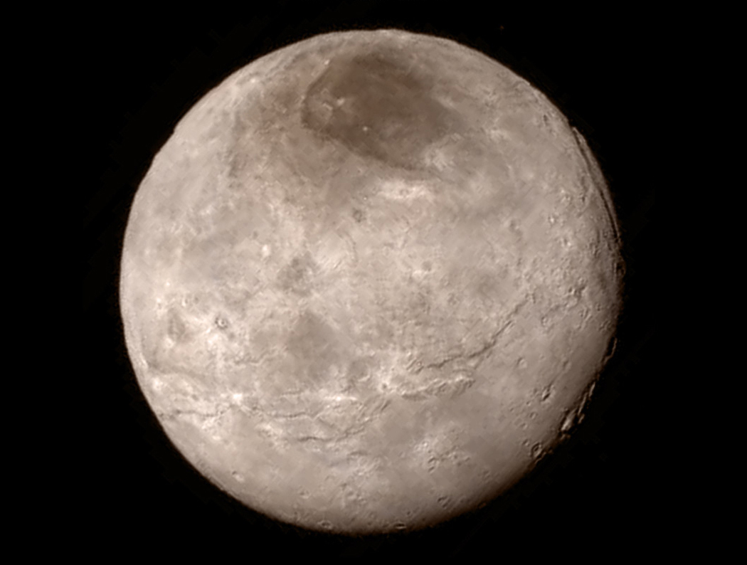 Charon, a moon of Pluto. When Charon is positioned between the sun and Pluto, Georgia Tech research indicates that the moon can significantly reduce atmospheric loss (image credit: NASA-JHUAPL-SwRI)