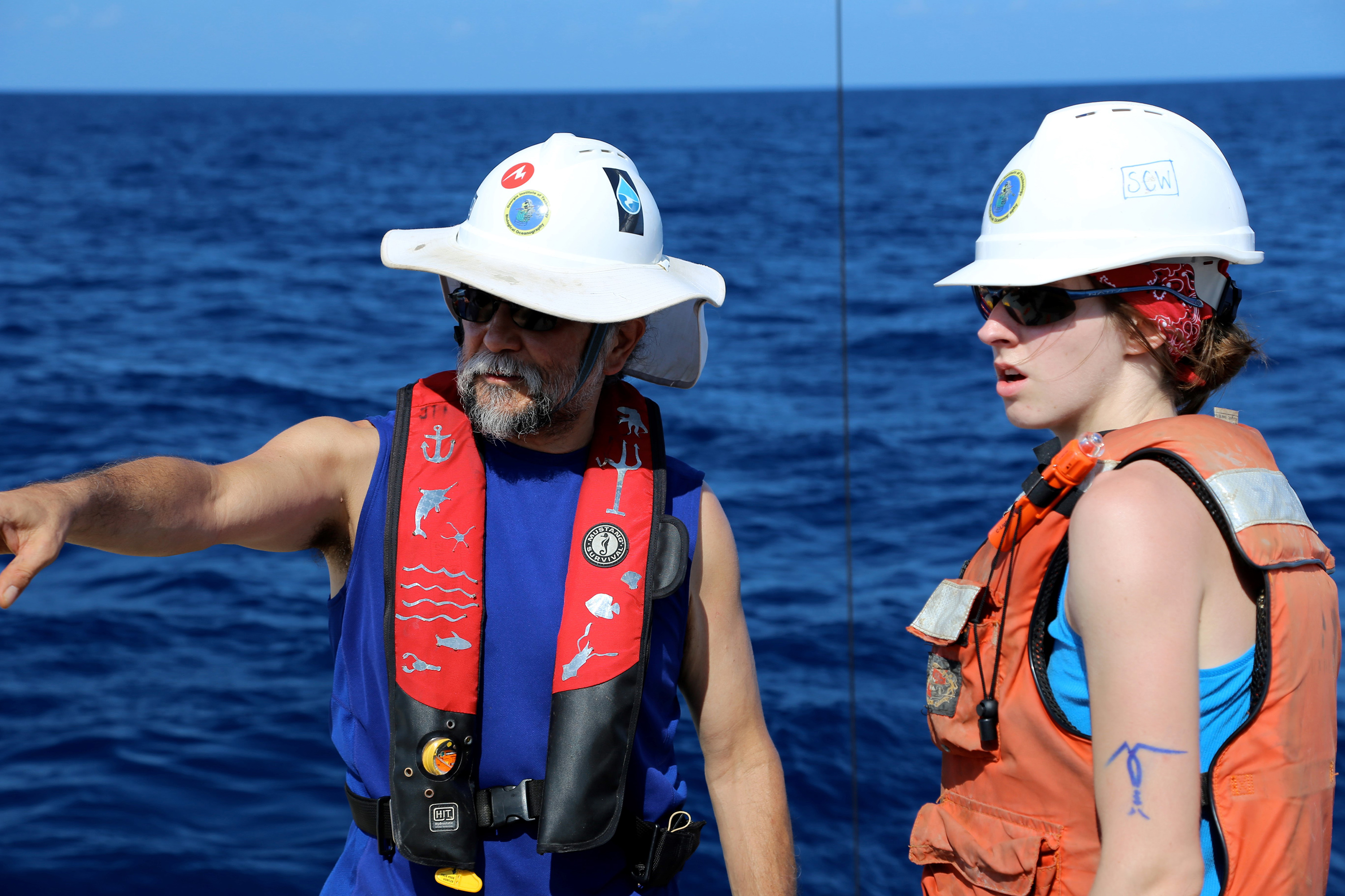 Georgia Tech Professor Joe Montoya and graduate student Sarah Weber prepare to recover equipment used to gather water samples in the Gulf of Mexico. (Credit: Ryan Sibert, University of Georgia)