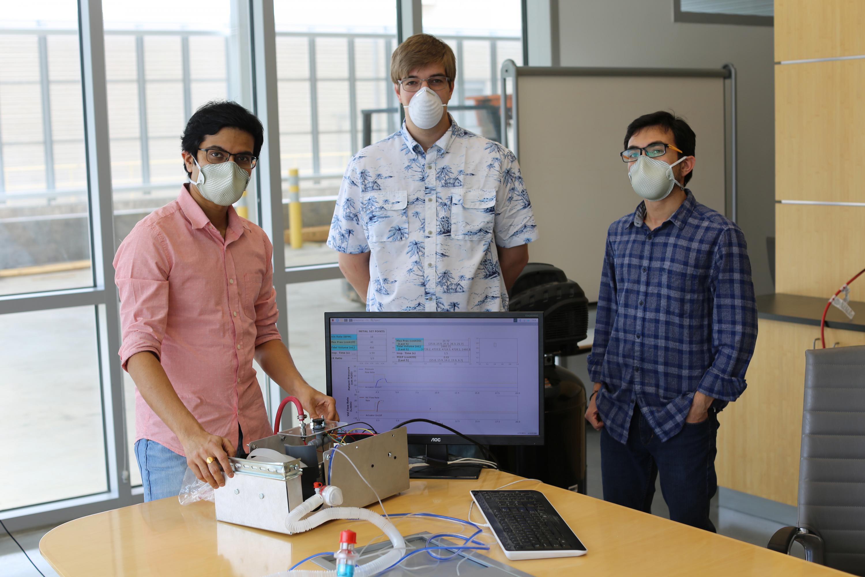 Georgia Tech Researchers Gokul Pathikonda, Stephen Johnston and Prithayan Barua are shown with their Open-AirVentGT, a low-cost, portable emergency ventilator that uses electronic sensors and computer control to manage key clinical parameters. (Credit: Ben Wright, Georgia Tech)