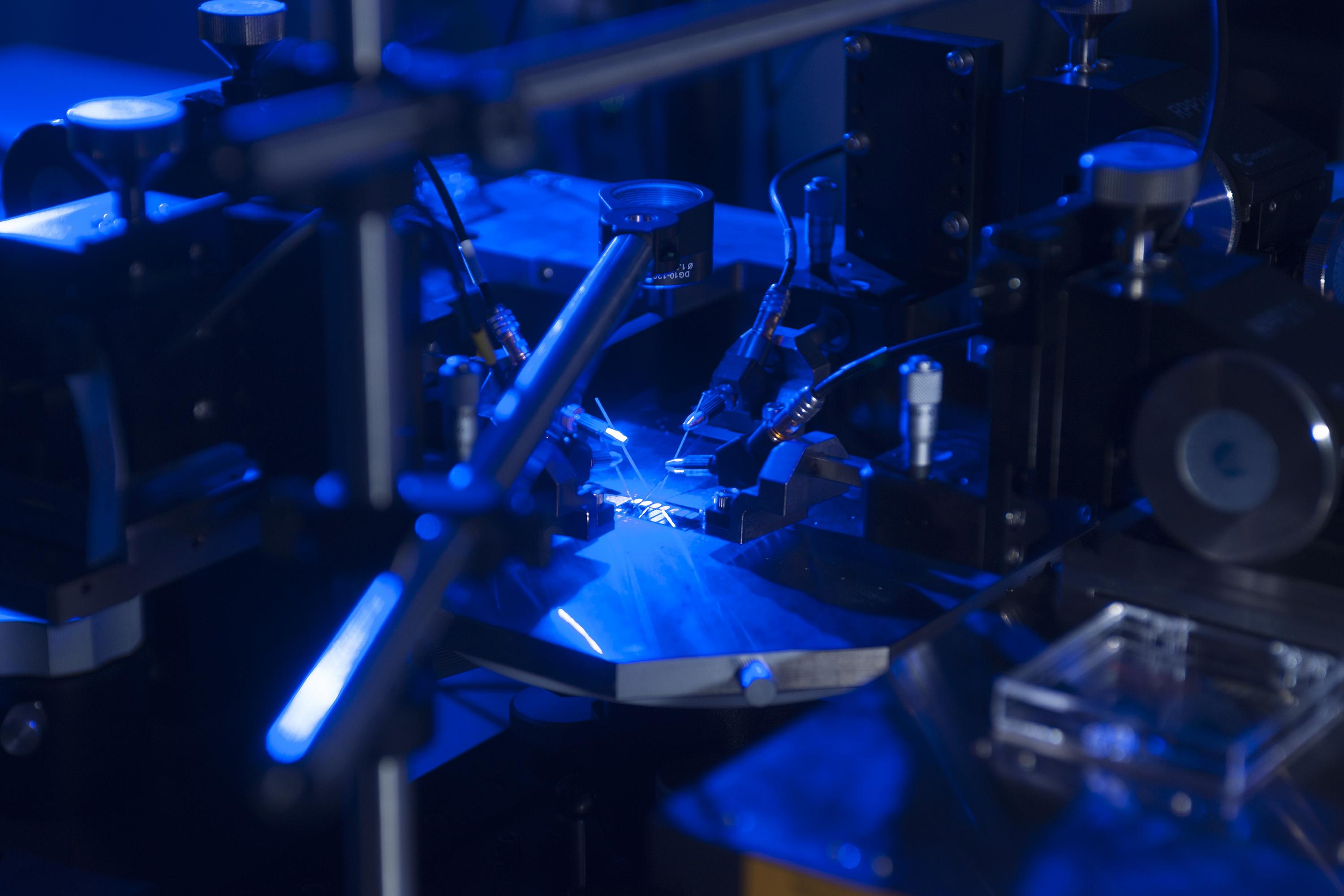 Georgia Tech researchers have developed a new higher efficiency rectenna design. Here, the device’s ability to convert blue light to electricity is tested. (Credit: Christopher Moore, Georgia Tech)